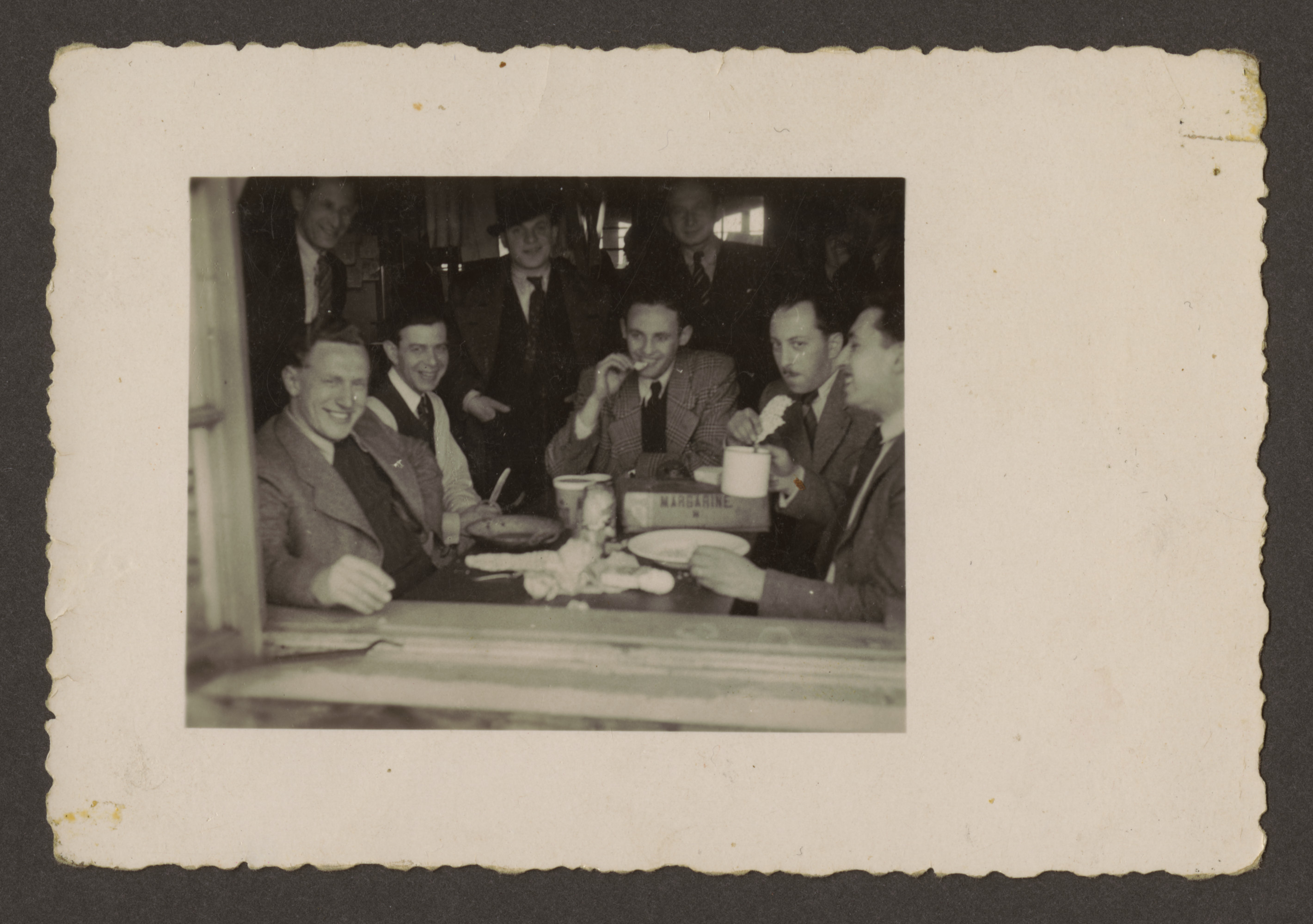 A group of friends shares a meal in the Westerbork transit camp.

Among those pictured is Erich Rosendahl (far right).