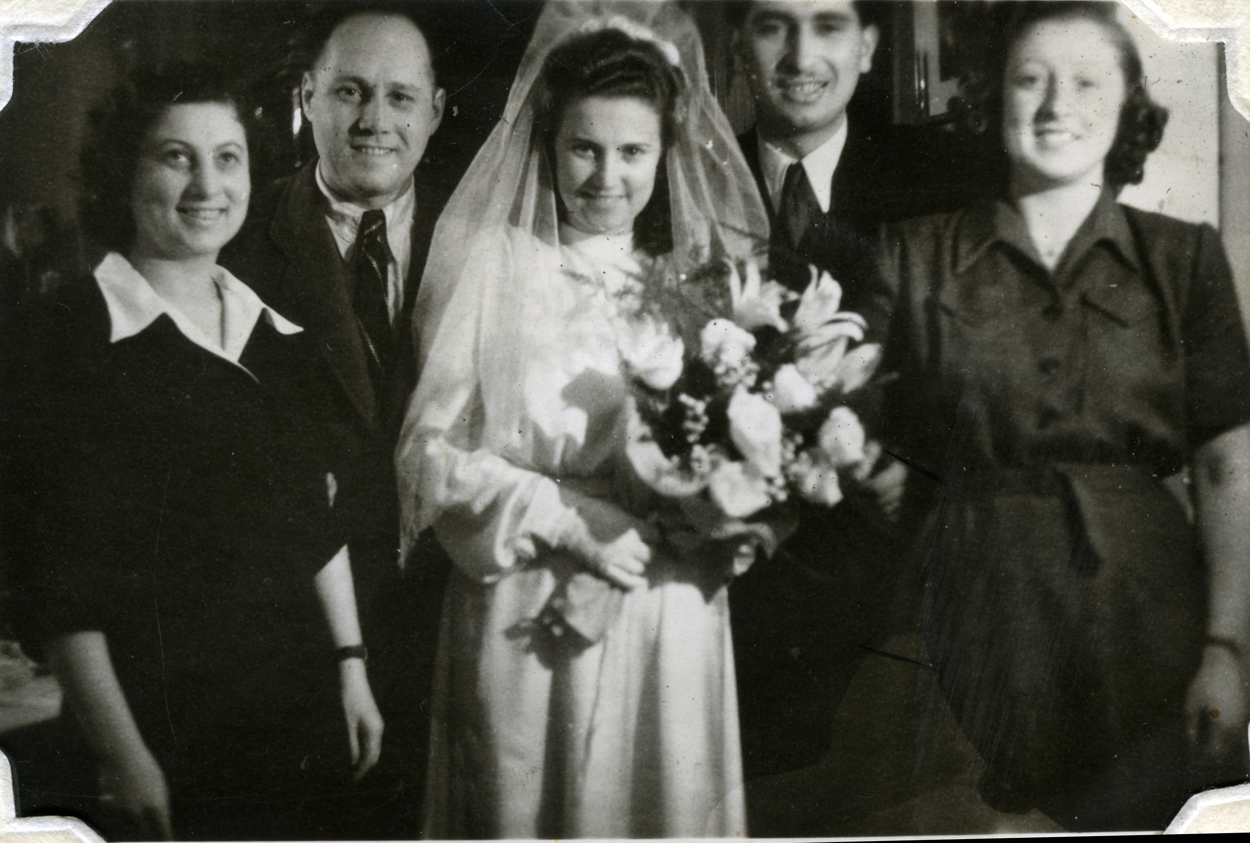 Wedding of Czech Jewish survivors in Podmokly, Czechoslovakia.

Pictured (left to right) are Matilda (nee Scheiner) and her husband Beila, Bella (nee Scheiner) and her husband David Perl, and Manci Scheiner.