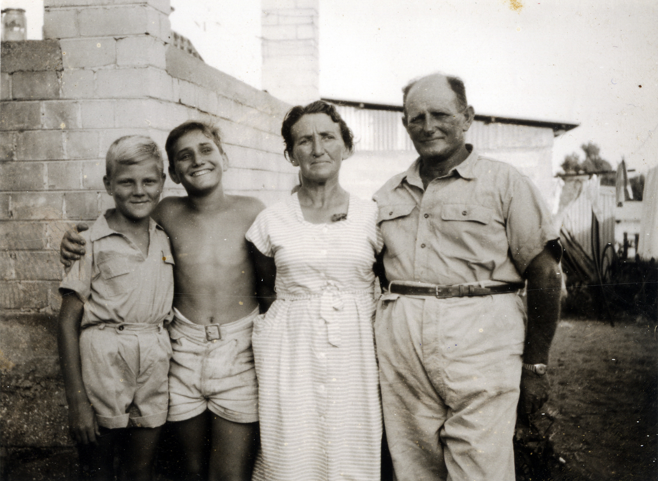 A young boy born in the Bergen-Belsen displaced persons camp, with his adoptive family in Israel.

PIctured (left to right) are Izak Szewelewicz with Giora, Salin, and Michel Bernay.
