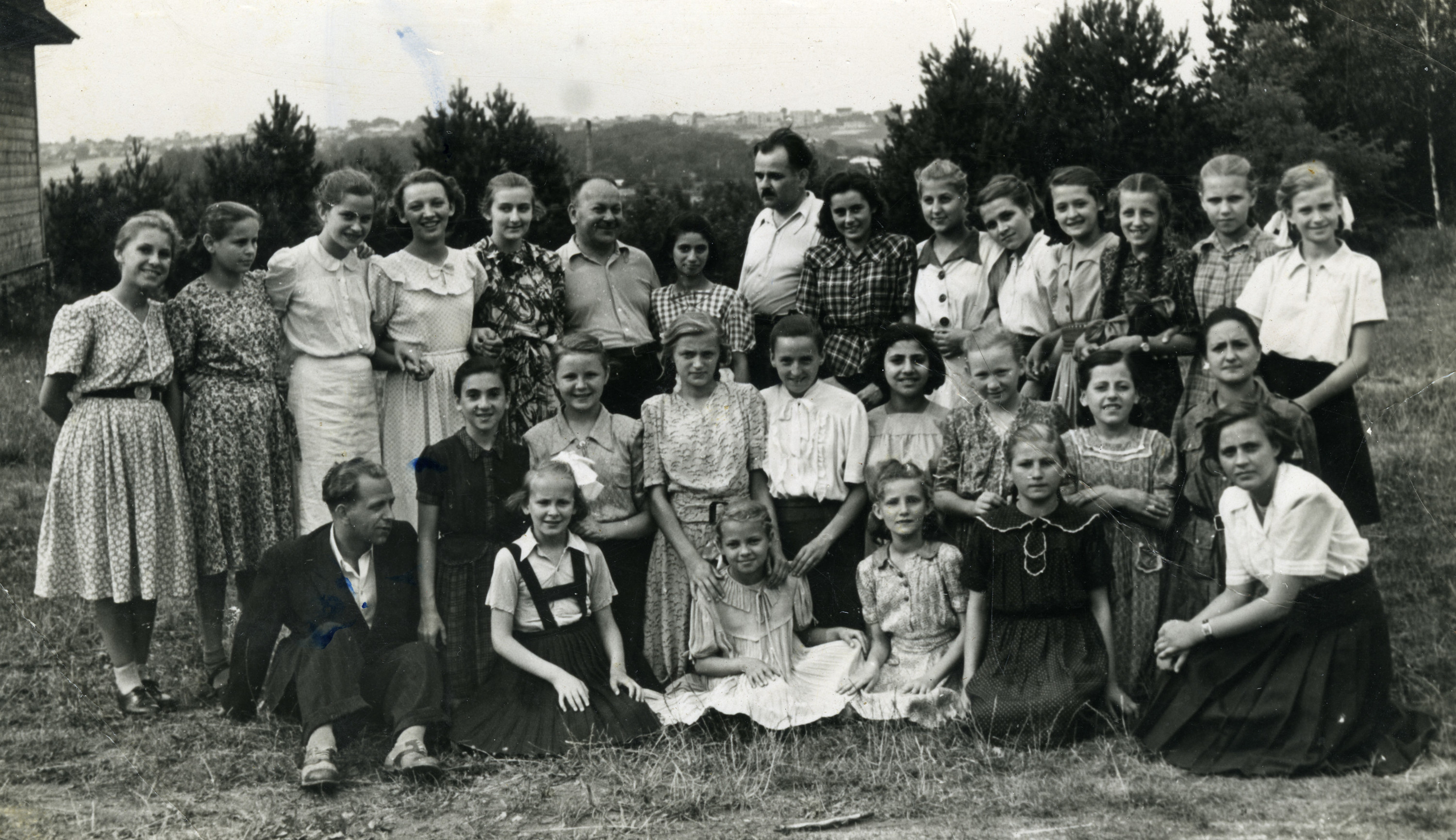 Children living in an orphanage in Warsaw, on vacation after the war.

Among those pictured is Leah Altman (kneeling in middle row, far left).