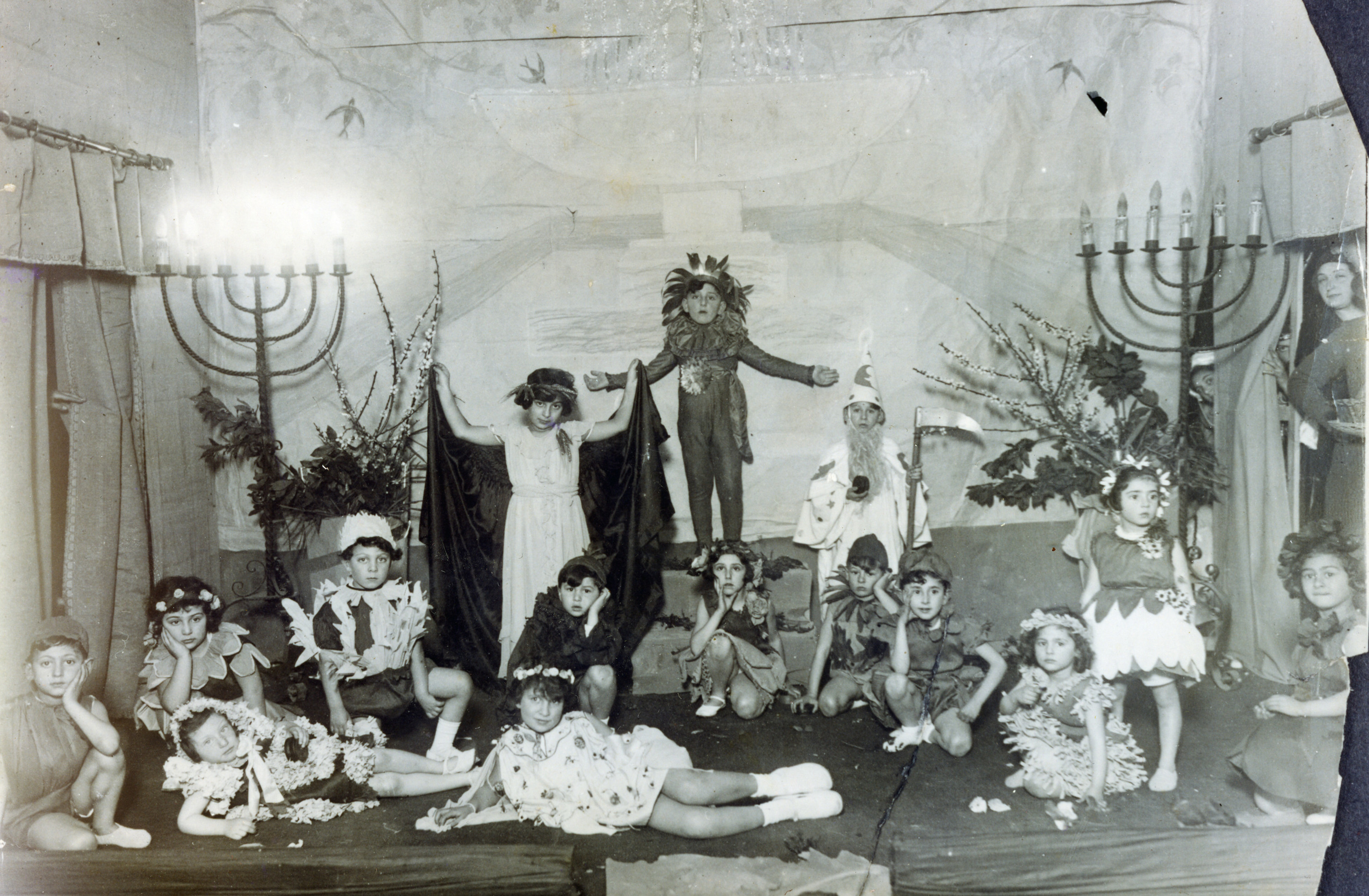 Italian Jewish children take part in a play to celebrate Shavuot.

Amont those pictured is Emma Di Capua (seated, third from the right).
