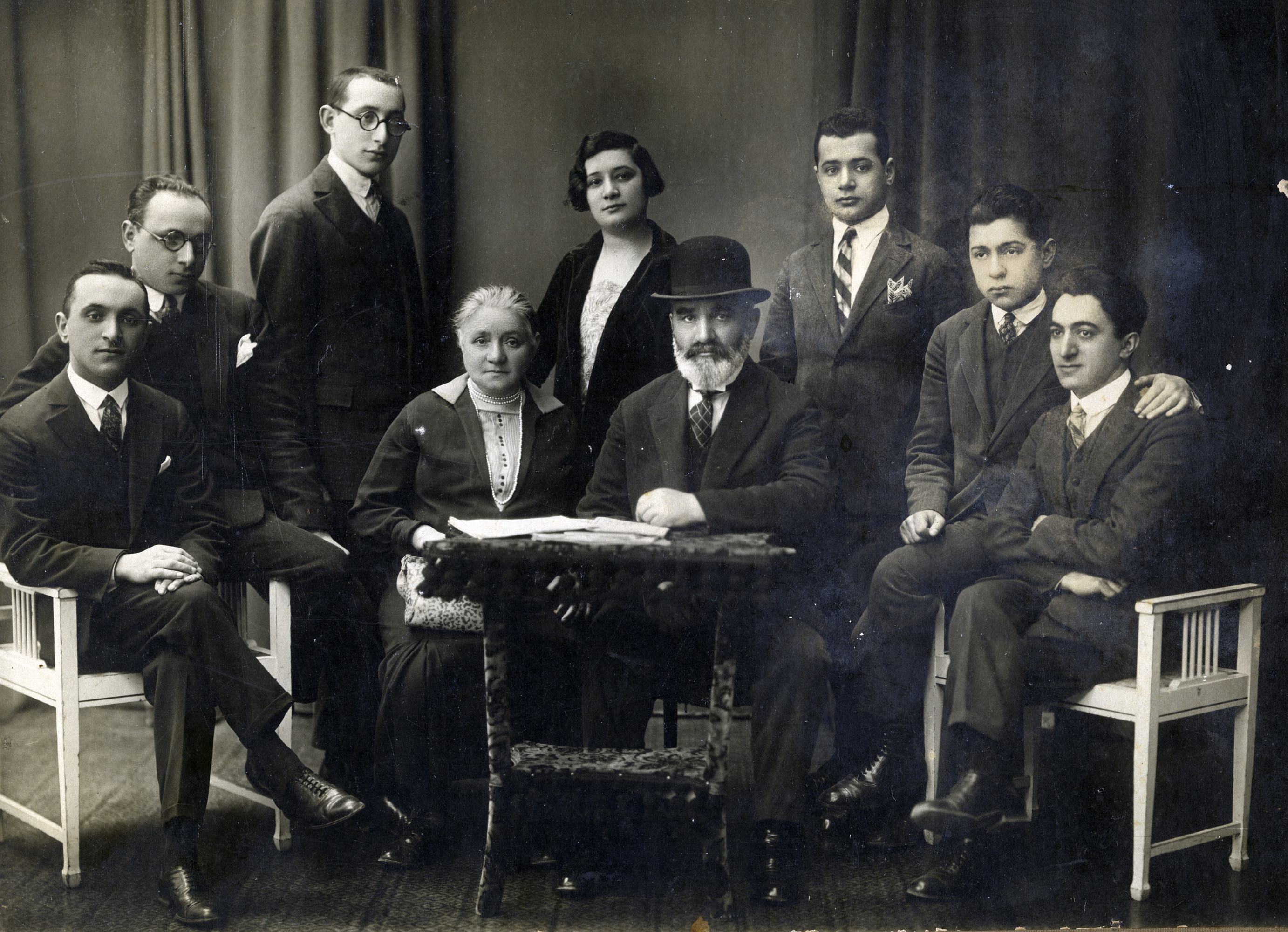 Portrait of the Intriligator family in Kovno.

Pictured are parents Yehuda Arie and Shaina Beila Intriligator (seated, center).  Around them are their children (left to right) [unidentified brother], Josef, Mordechai, Chasia, Avram, Baruch, and David Beit Arieh.