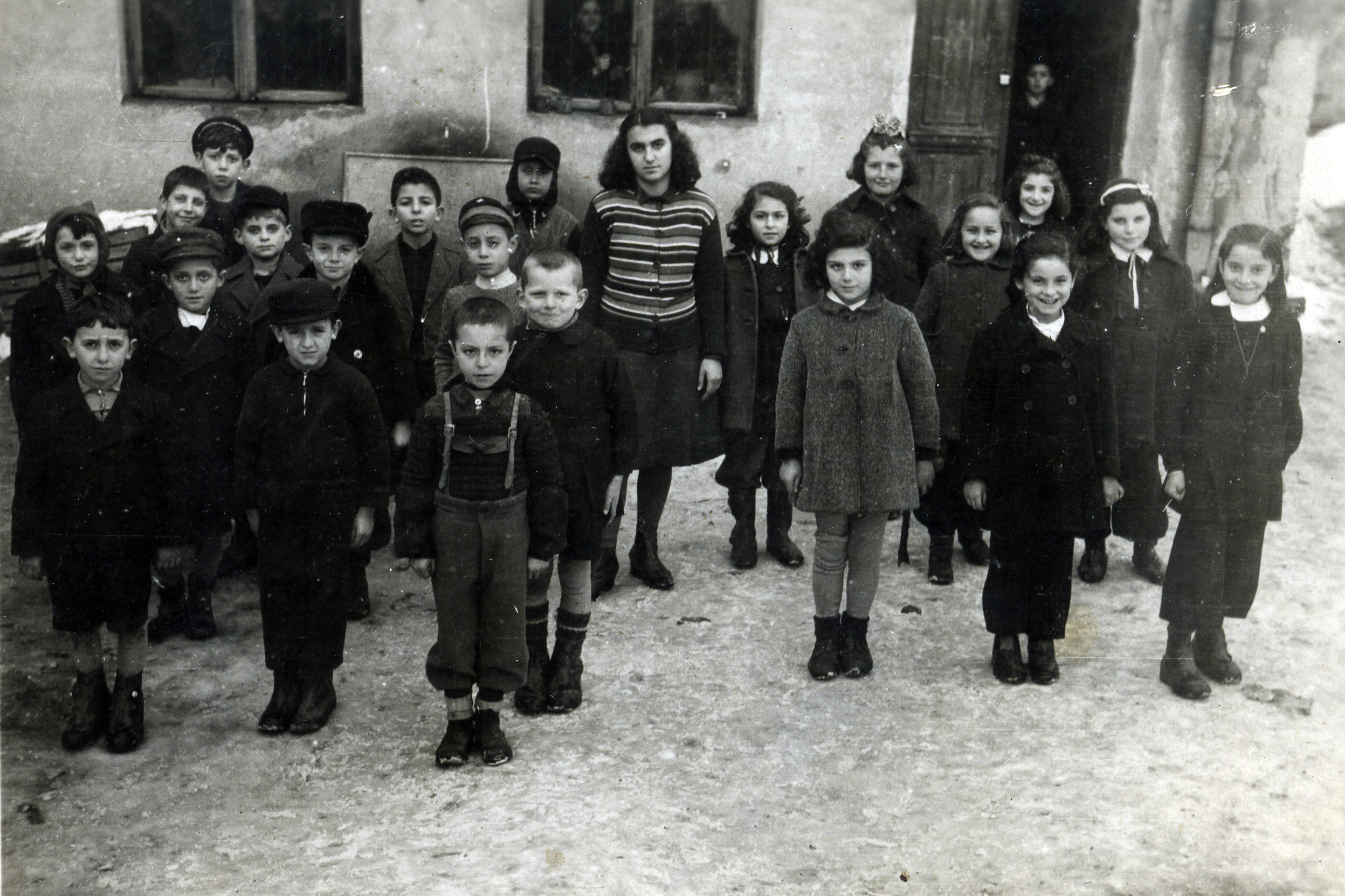 Children in the Jewish school in Ferdinand, Bulgaria.

Among those pictured is Avraham Alajem (back row, between the two windows).