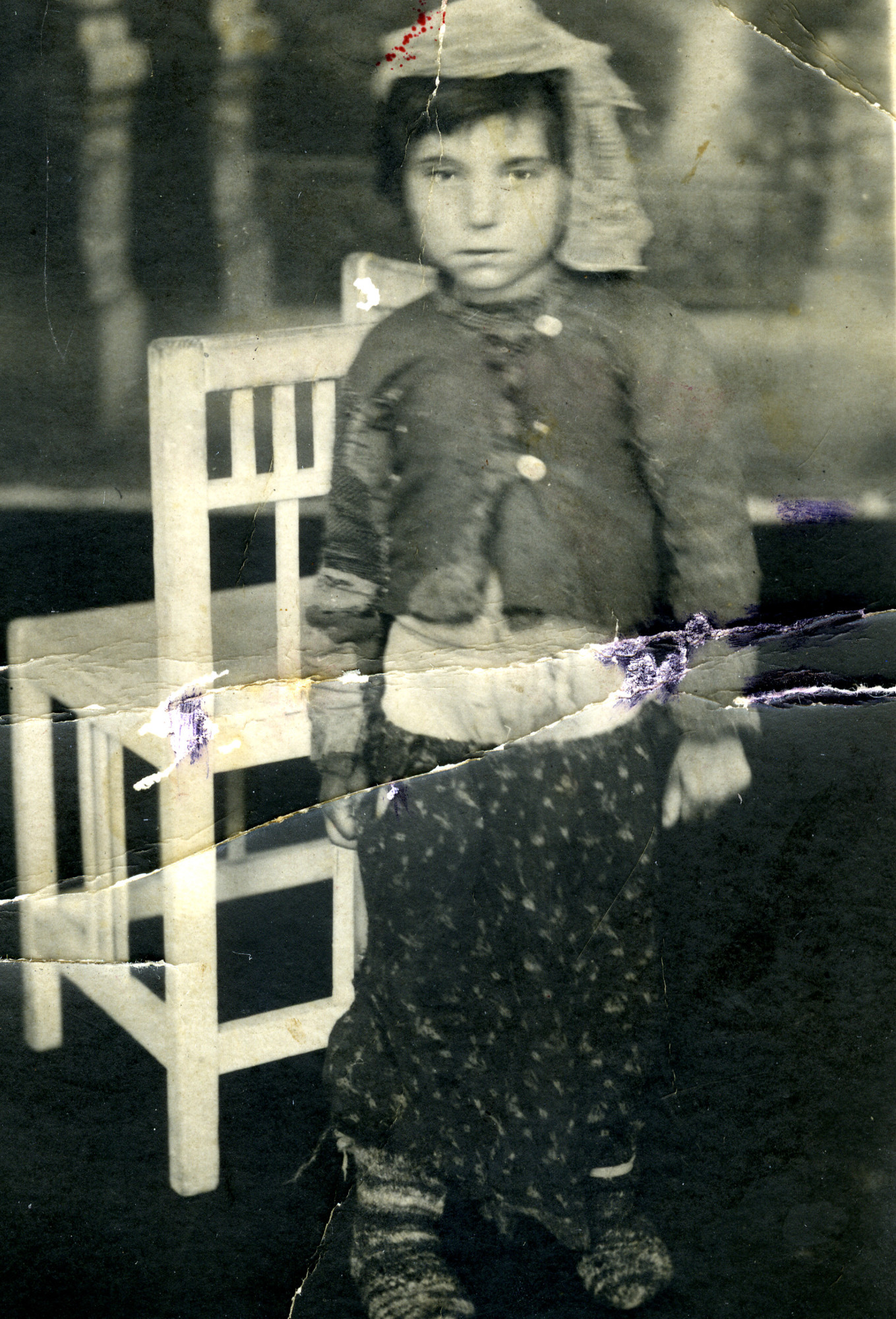 Portrait of five-year-old Ester Bachar (later Levi), shortly after the war.

Ester was hidden by a Roma family during the war.
