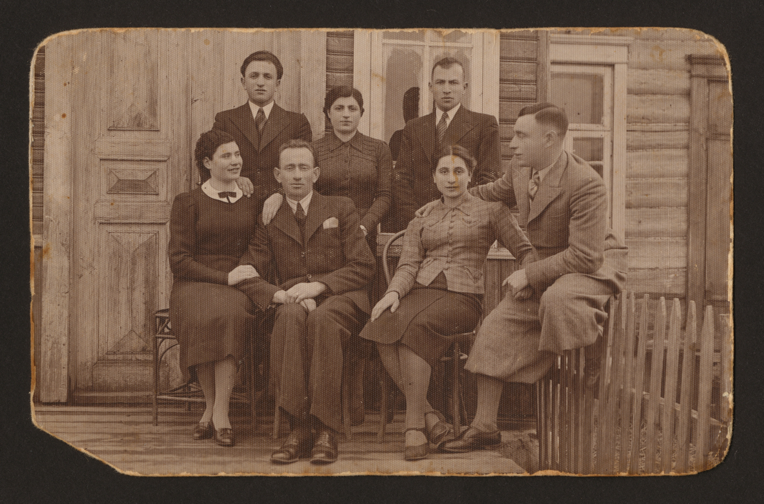 Group portrait of the Markman siblings and friends on a porch of a home in Parafianov, Poland (now Belarus), April 18,1938

Seated in the front row (left to right) are Chaya Markman, [unidentified], Genia Markman, and Moshe Markman.  Pictured in the back row (left to right) are [unidentified], Zlatah Markman, and [unidentified].