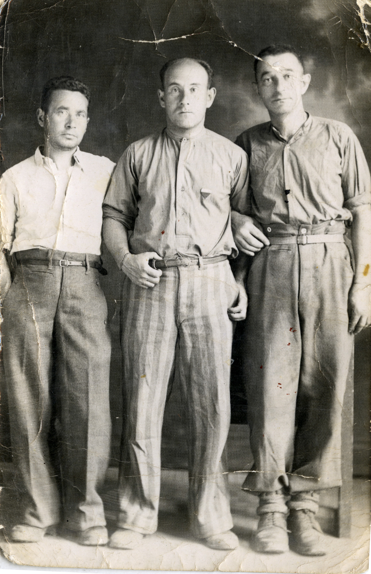 Portrait of three survivors shortly after their  liberation from the Dachau concentration camp.

Among those pictured is Yaakov Michles (right).