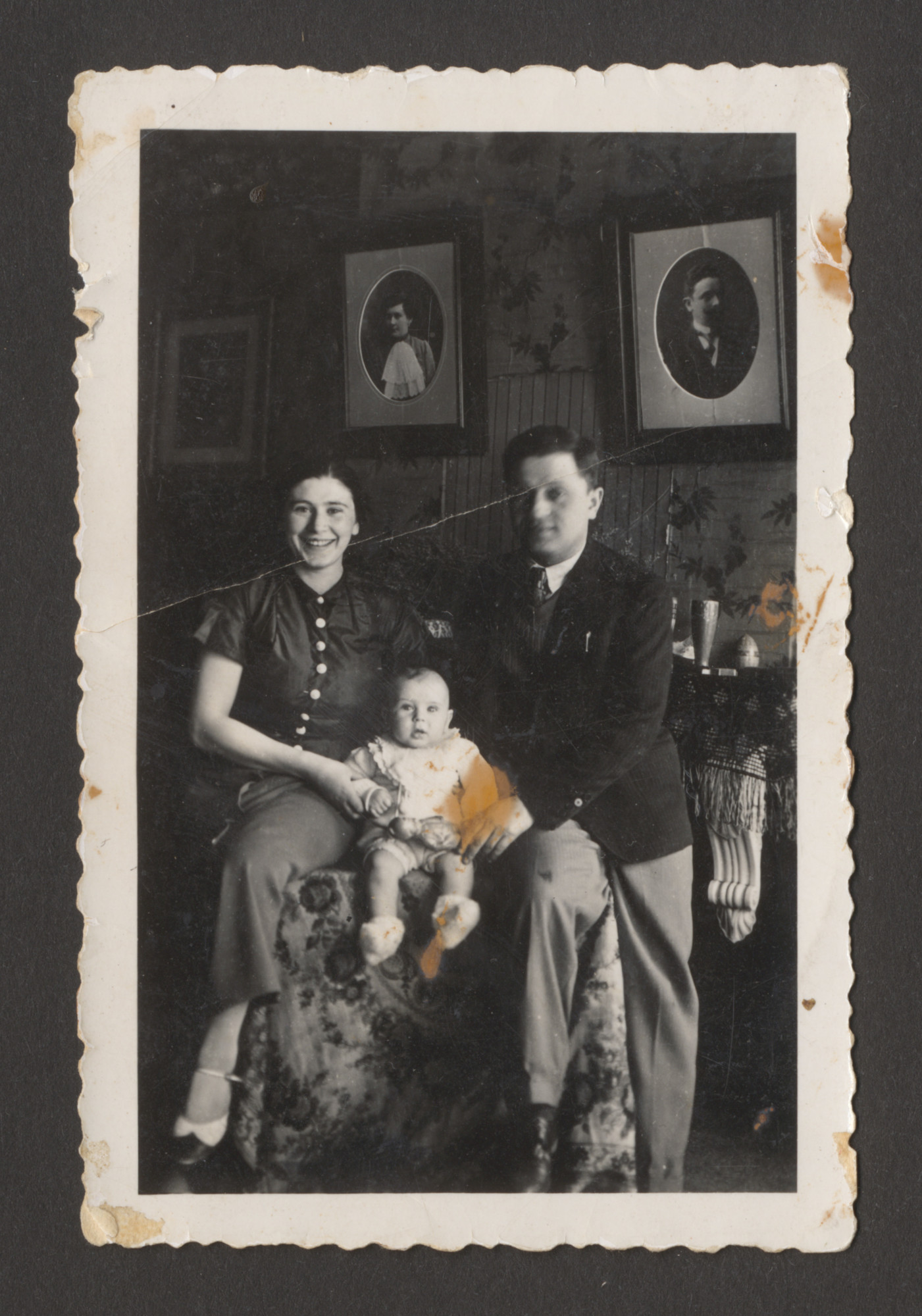 Portrait of a Belgian Jewish family.

Pictured are Maria and Leon Srebnik with their infant son Charles.