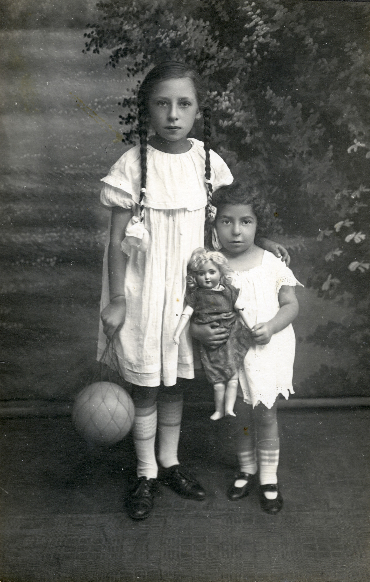 Studio portrait of the Muller sisters in Lida.

Pictured are Sheyna and Batya Muller.