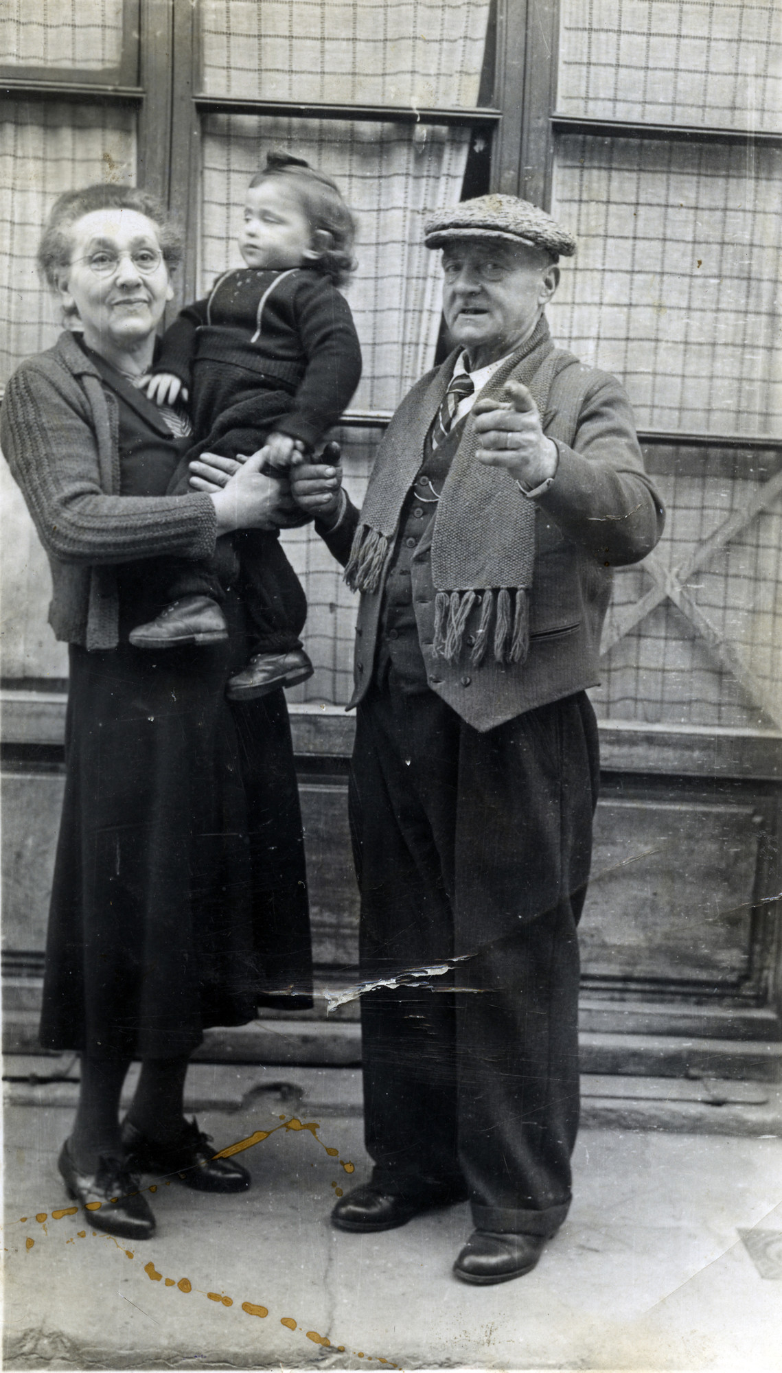 Two-year-old Lazare Tannenbaum with a French couple who had a tobacco store in Moirans and helped care for him.