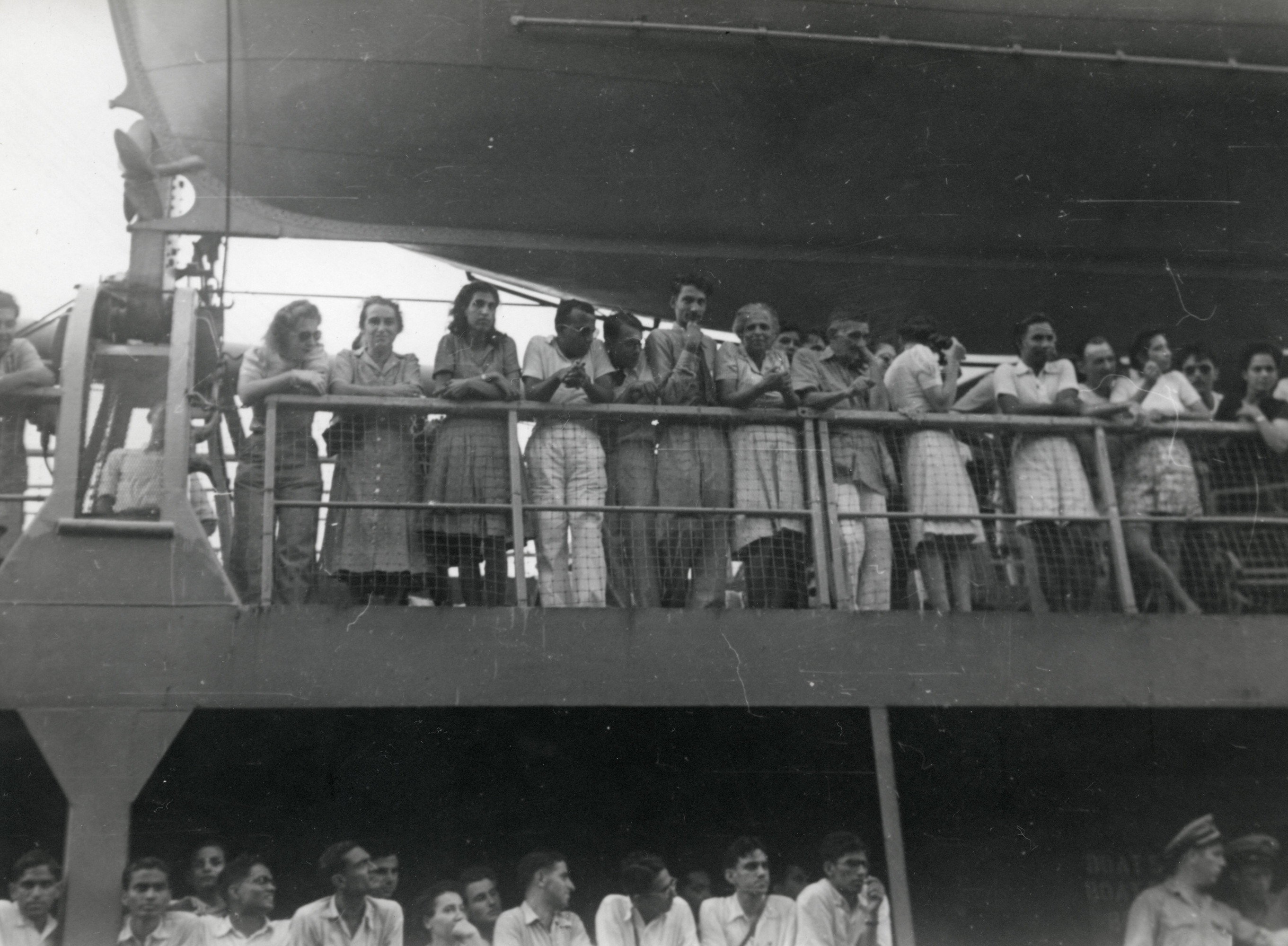 Passengers on board a ship travelling from India to Seattle, Washington.

Among those pictured is Berta Herlinger (second from the left).  She would continue on her trip to live for a time in Spokane.