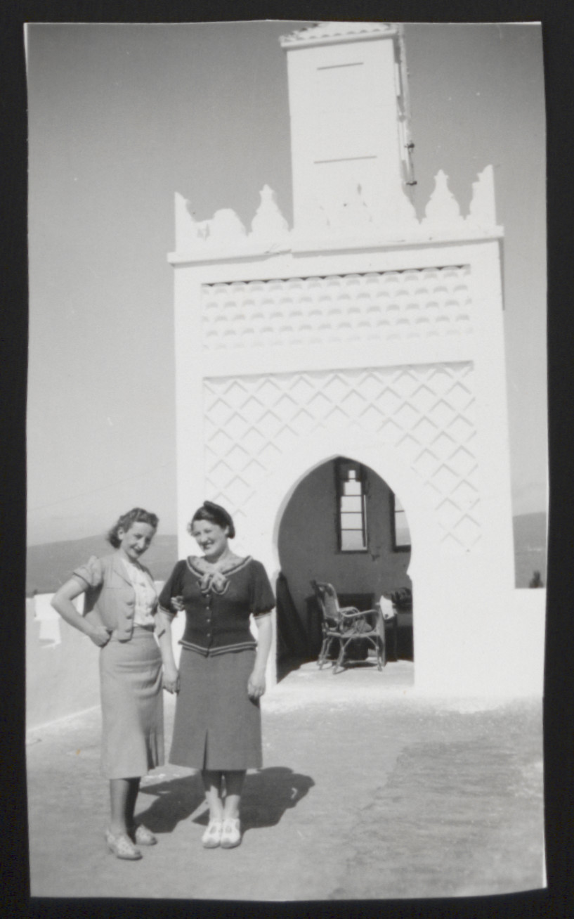 Lilly Roth and a friend pose outside an ornate arch in Tangier.
