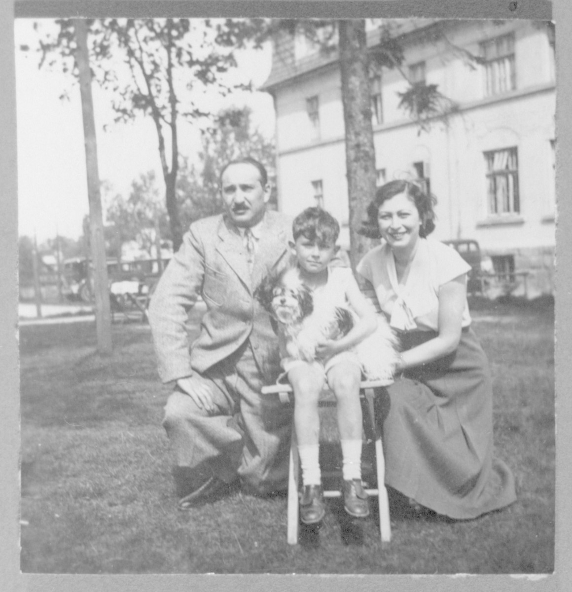 Roman Frister poses with his parents, Franciszka and Wilhelm, on the grounds of the Villa Maria in Szczyrk, Poland.