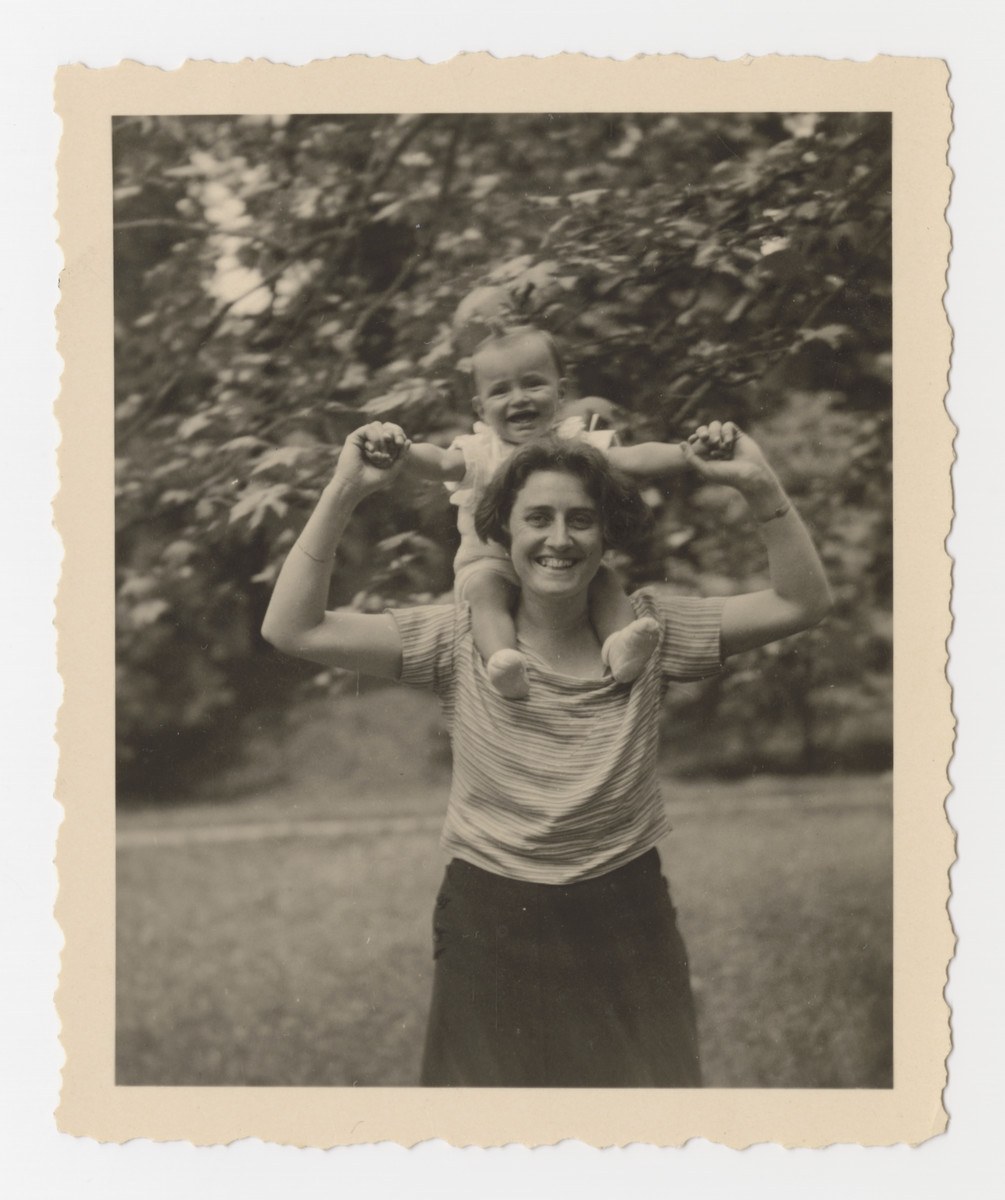Klara Brecher poses holding her baby son Heinz on her shoulders in Graz, June 2, 1933.
