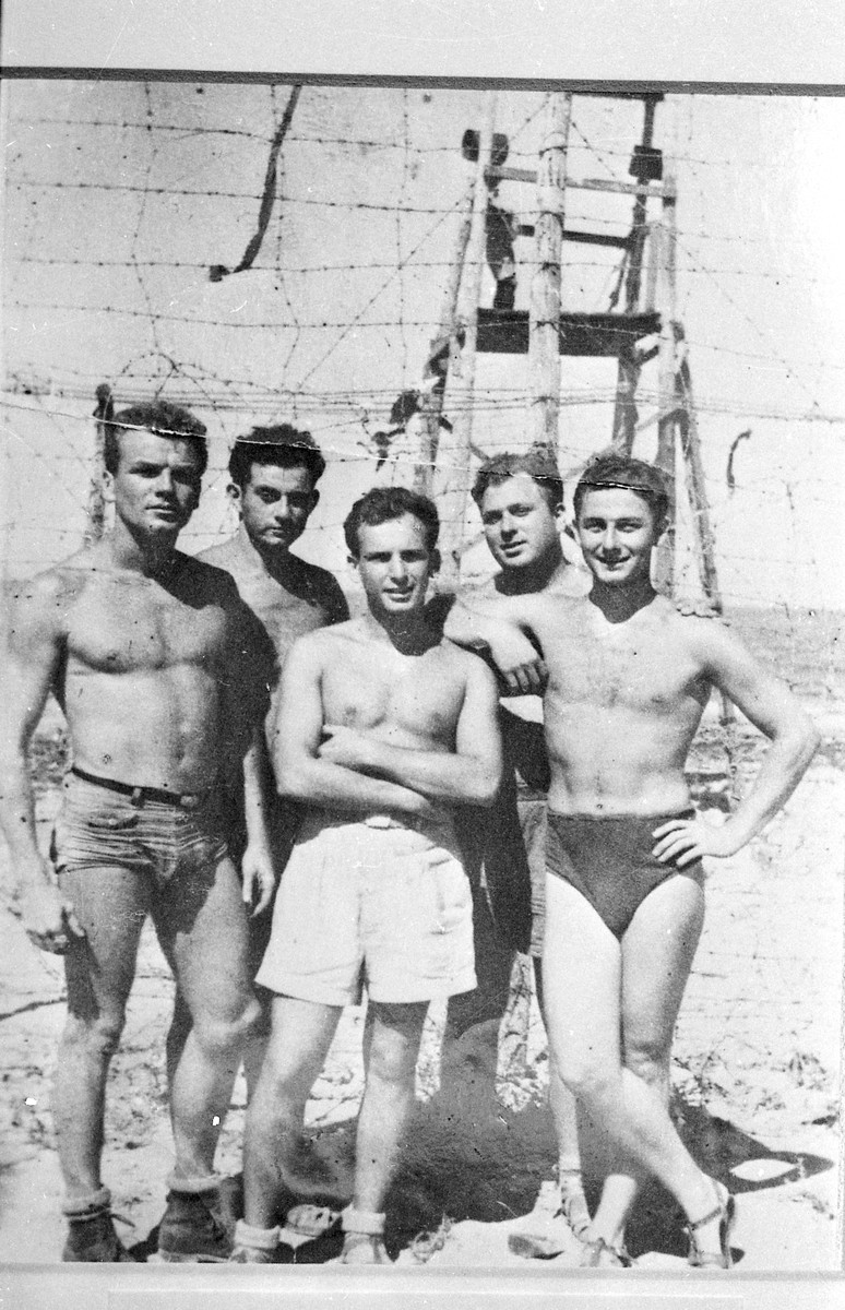 Murray Greenfield (far right) and other American volunteers who worked on behalf of immigration to Palestine stand in front of a British guard station in the Cyprus internment camp.