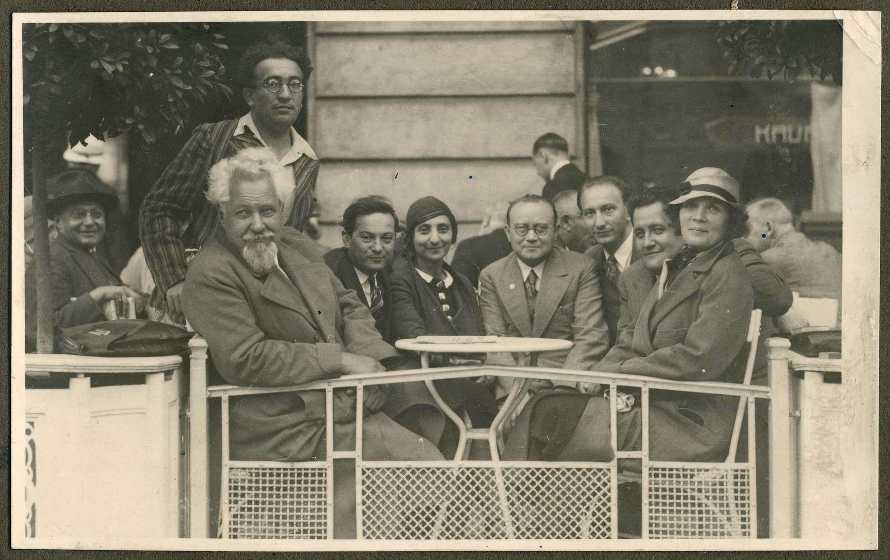 Zionist leaders gather at a cafe in Prague probably during the 18th Zionist Congress.

Menachem Ussishkin is pictured on the left with the beard.  Samuel Gotz is pictured second from the right.