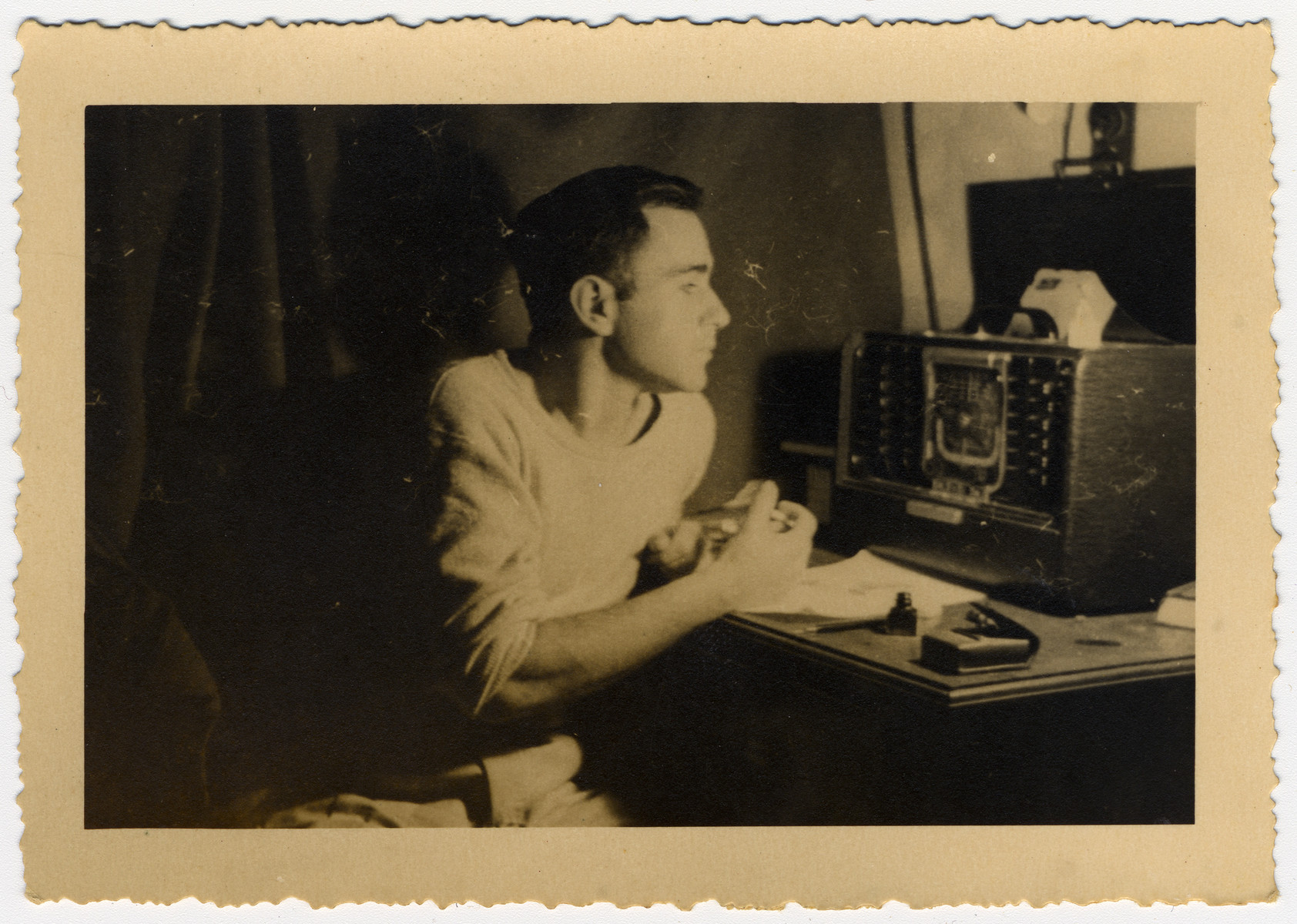 Chief radio operator William "Sonny" Weintraub operates the radio of the Galila.