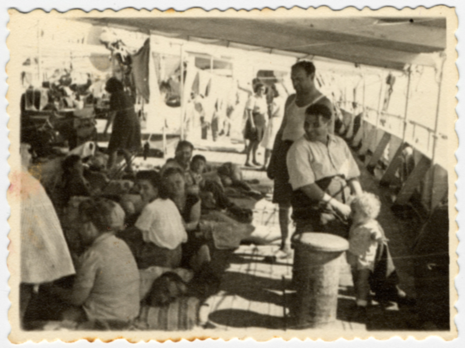 Passengers relax on a deck of  the Atzmaut (Pan Crescent) while en route to Palestine.