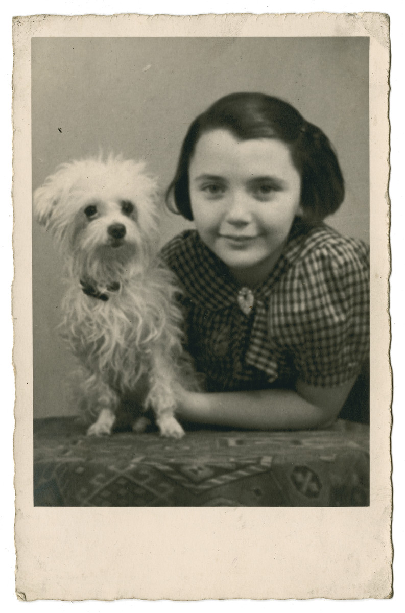 Sonja Goldman (a friend of the donor) poses with her dog prior to her immigration to England..

She met Ilse at the Refugee Hostel 34 Wheeleys Rd., Birmingham and became best friends. Sonja's mother worked as a domestic in Birmingham while Sonja lived in the Refugee Hostel. Sonja later married an Englishman, Hank Hancox.