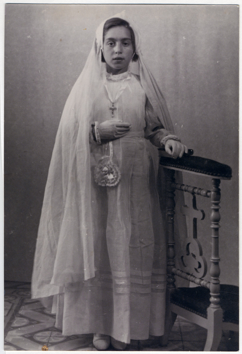 Paulette Feiler, a  French Jewish girl takes her first communion while in hiding.