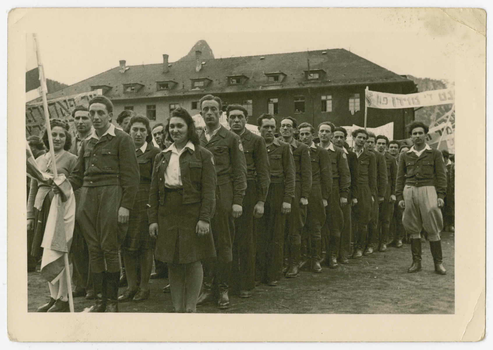 Jewish men and women stand in a line for a demonstration in the Bad Reichenhall displaced persons camp.