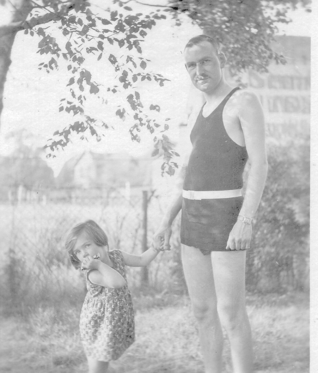 A father and his daughter holding hands posing for the camera.

Pictured are Wilhelm (Willi) Weinlaub (older brother of Kurt) and his daughter Edith.  They lived in Hannover, Germany until 1934, when they moved to England.