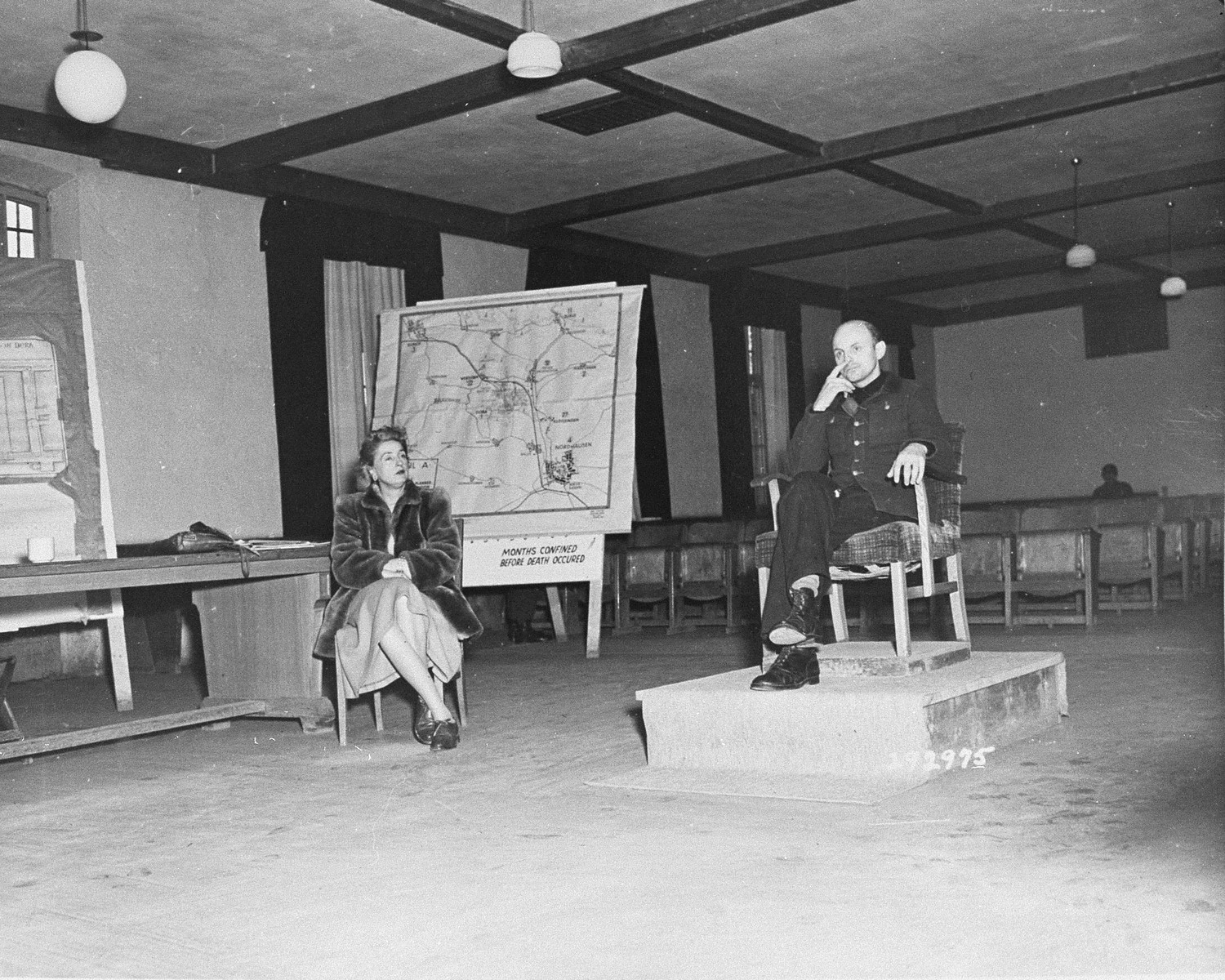 Former SS Colonel Gerhard Maurer testifies for the defense at the trial of former camp personnel and prisoners from Dora-Mittelbau. To the left is Emily Polyn-Cobb, an interpreter.
