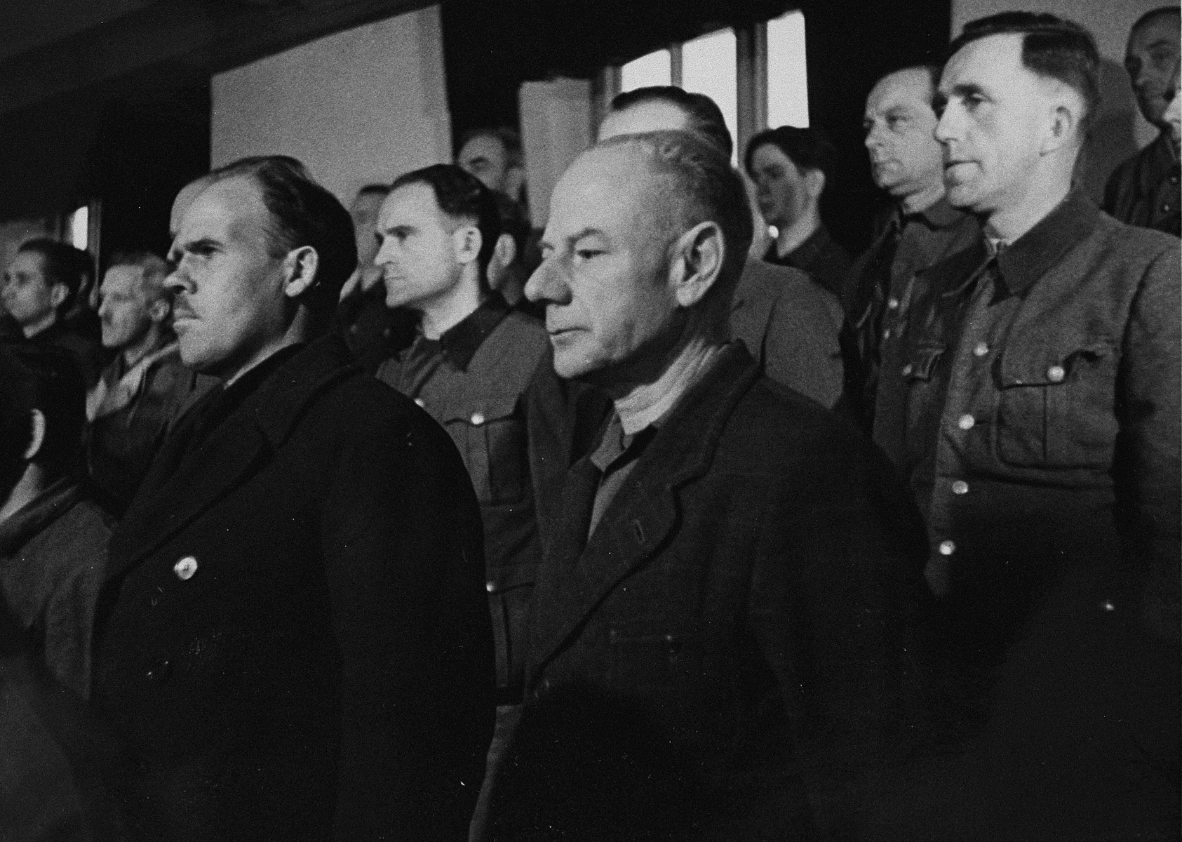 View of the defendants' dock during a session of the trial of 61 former camp personnel and prisoners from Mauthausen.  

Pictured in front is defendant Dr. Eduard Krebsbach.