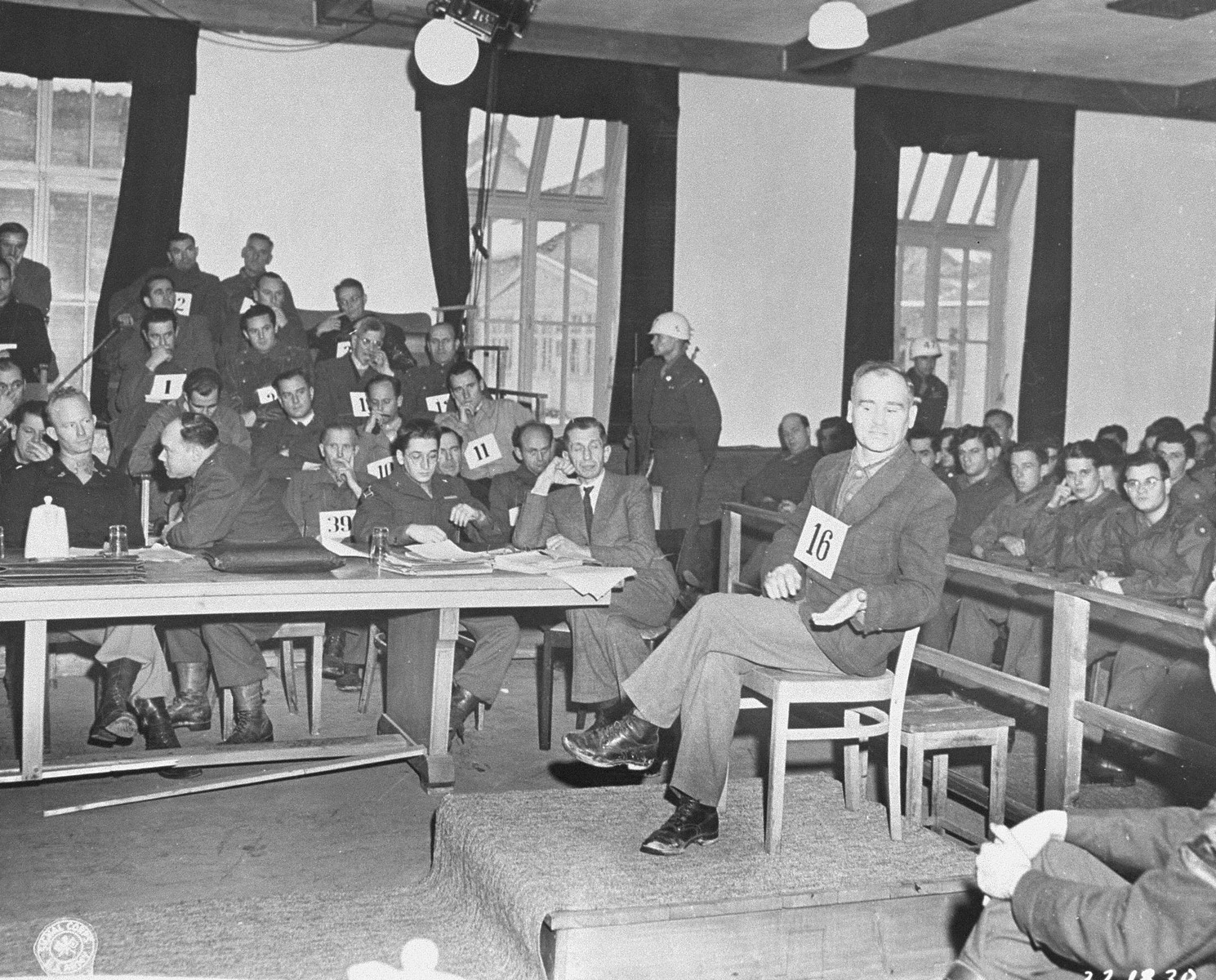 Defendant Christof Ludwig Knoll, a former political prisoner and block leader, testifies at the trial of former camp personnel and prisoners from Dachau.