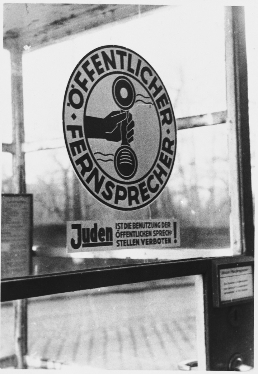 Sign on a phone booth in Munich prohibiting Jews from using the public telephone.