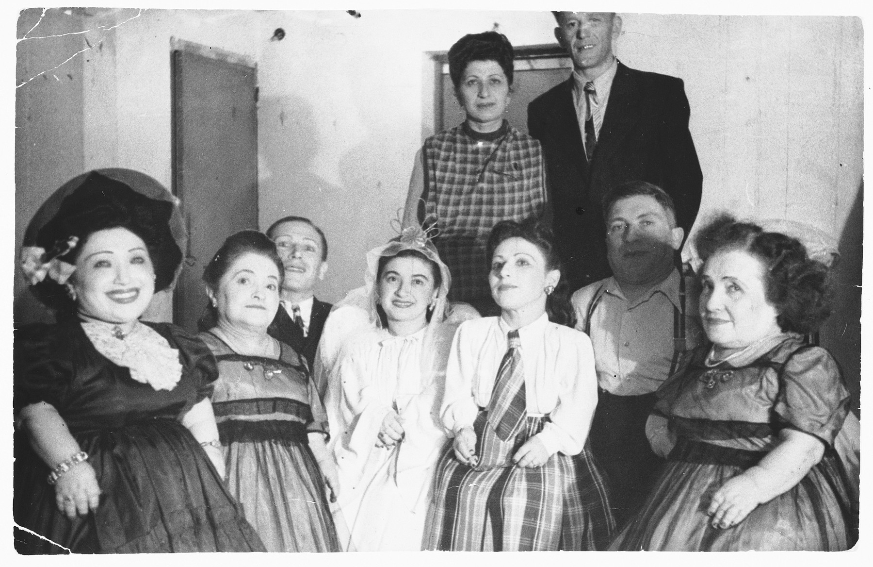 Group portrait of the Ovici family, a family of Jewish dwarf entertainers who survived Auschwitz.

The two people of normal height standing in the back are their sister Sara Ovici, and Moshe Moskowitz, the husband of Elisabeth Ovici.
