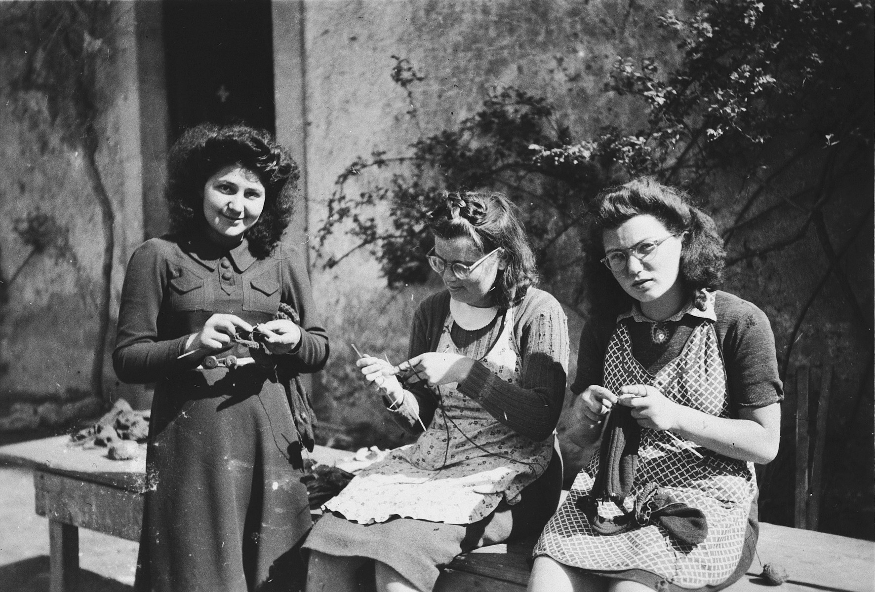 Girls practice knitting in Chateau de la Hille.

Pictured are Gerti Lind, Anne-Marie Piguet (a teacher) and Cilly Stueckler.