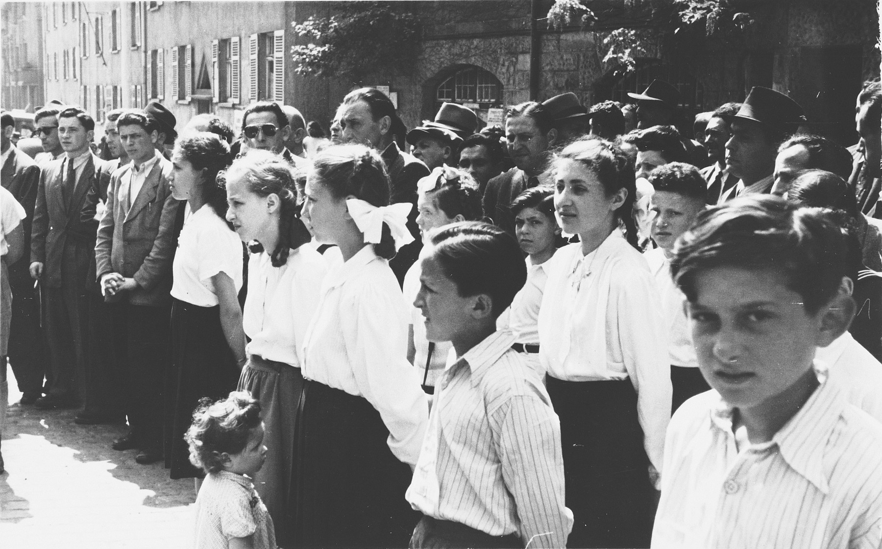 School children gather for a ceremony marking Israel's independence in the Stuttgart displaced persons' camp.