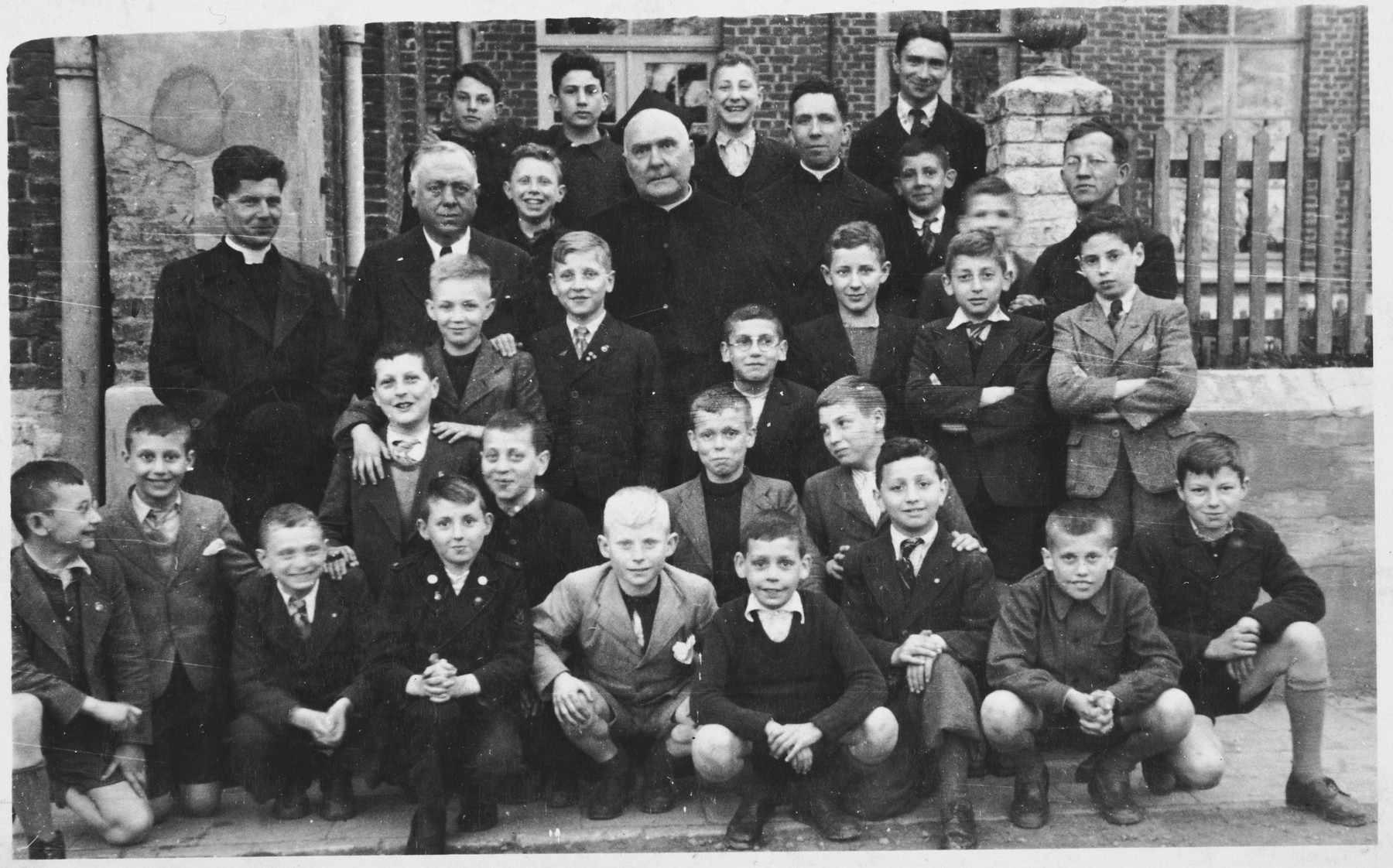 Group portrait of students at the Melle monastery, where Jewish boys were hiding during the German occupation of Belgium.

Among those pictured is Jacques Kucinski (third row, second from the right).