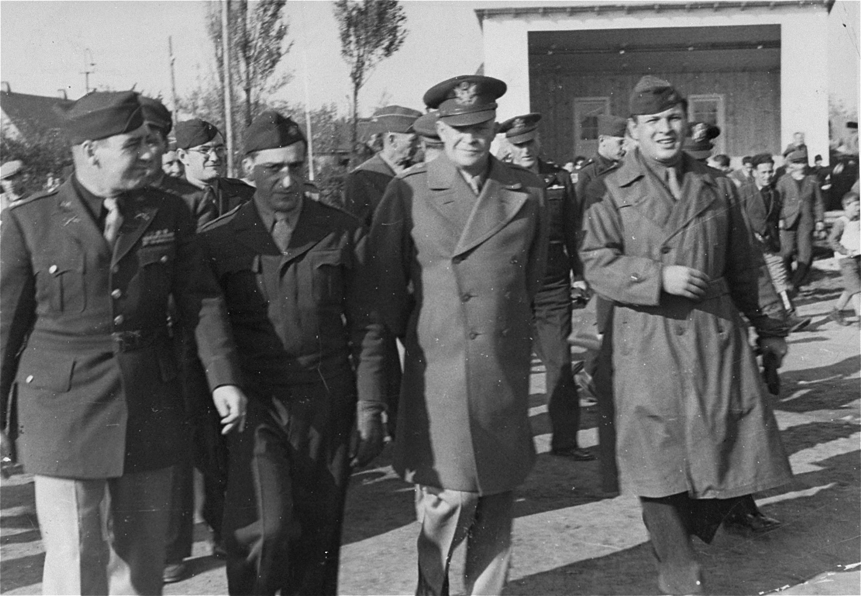 Camp director Saul Sorrin gives General Dwight Eisenhower a tour of the Neu Freimann displaced persons camp.

Eisenhower's visits to Neu Freimann and other displaced persons' camps in the fall of 1945 was prompted by a strongly worded cable he received  from President Truman directing him to institute reforms to improve living conditions of displaced Jews in the American zone of occupation.