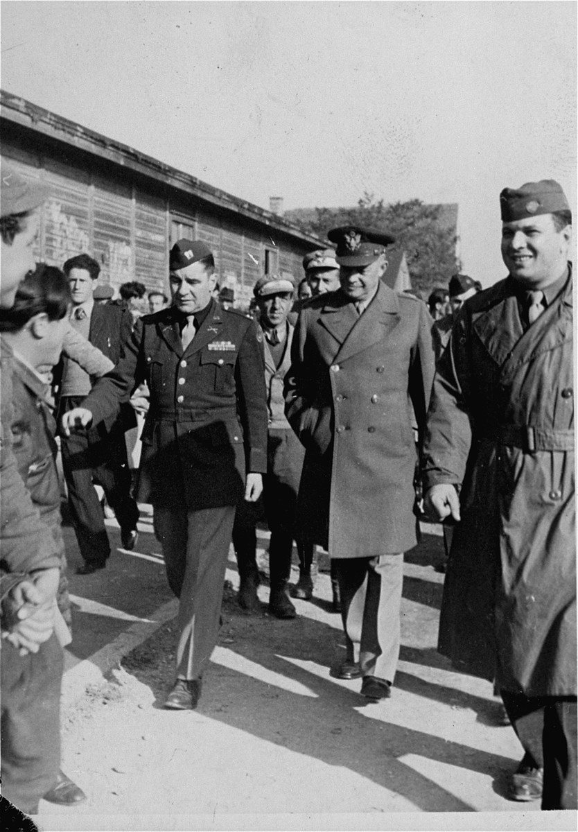 Camp director Saul Sorrin gives General Dwight Eisenhower a tour of the Neu Freimann displaced persons camp.

Eisenhower's visits to Neu Freimann and other displaced persons' camps in the fall of 1945 was prompted by a strongly worded cable he received  from President Truman directing him to institute reforms to improve living conditions of displaced Jews in the American zone of occupation.