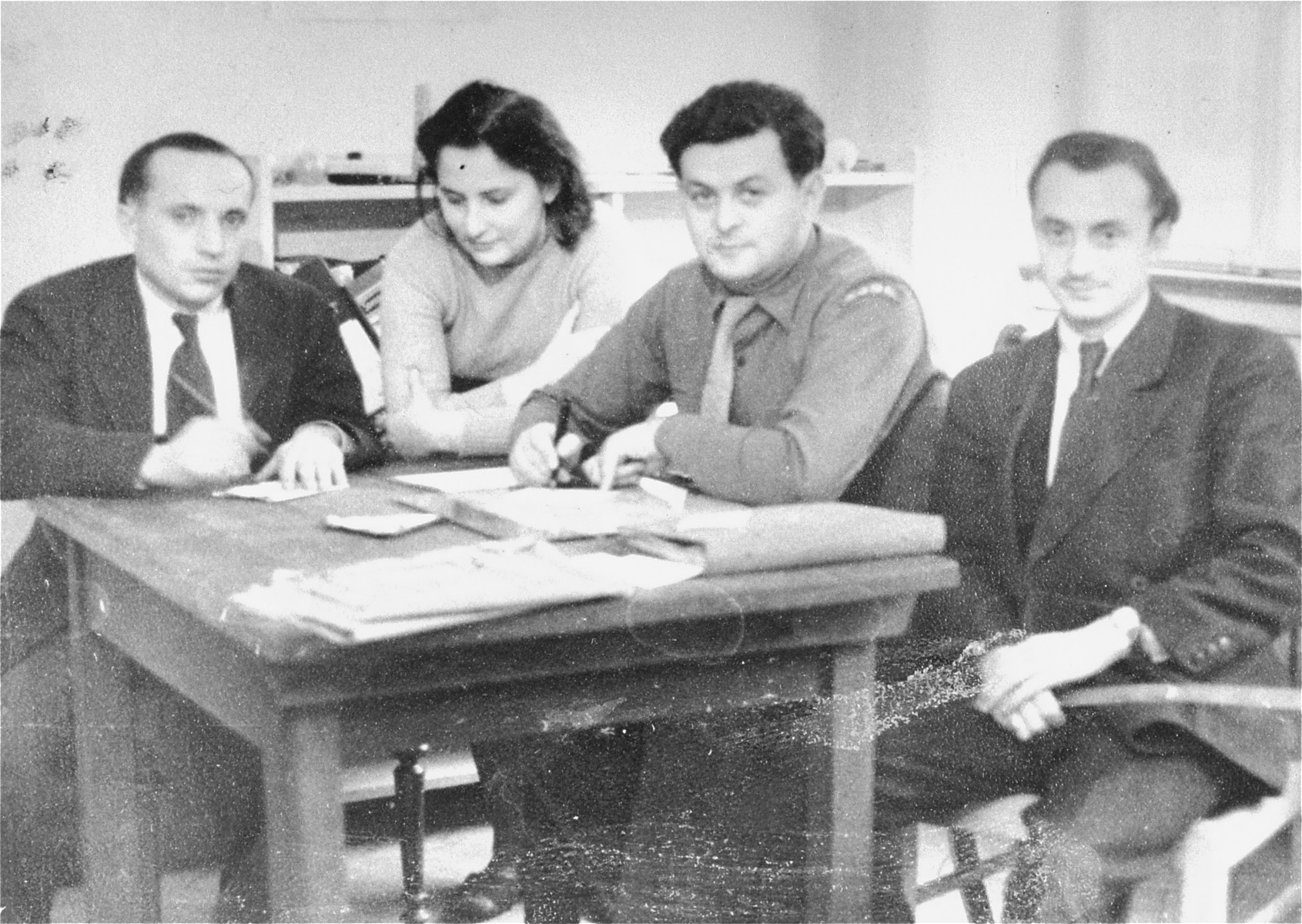 UNRRA workers meet at Student's Hostel in Stuttgart.  

Henry Brauner, UNRRA supply officer, is on the far right.