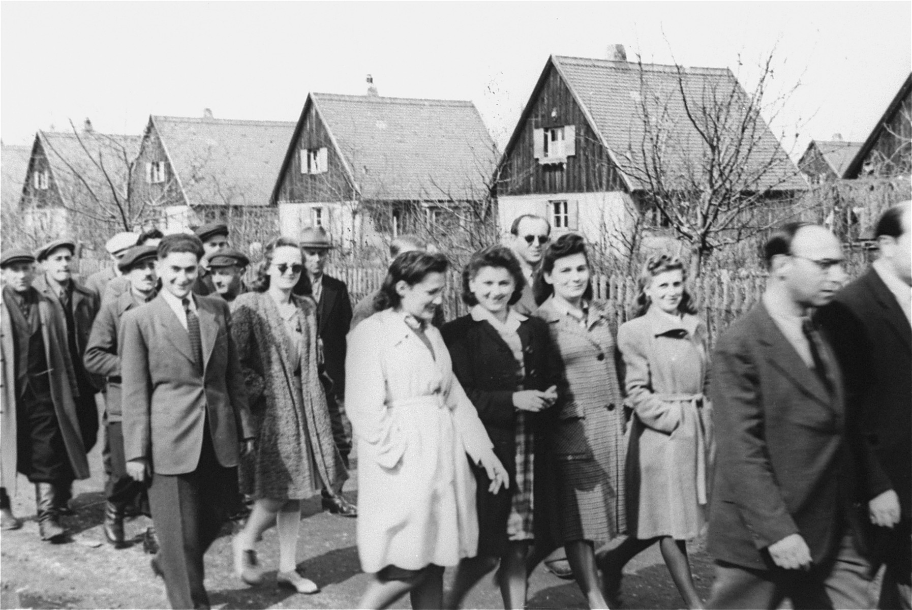 Young Jewish DPs walk in a procession along a street in the Neu Freimann displaced persons camp.