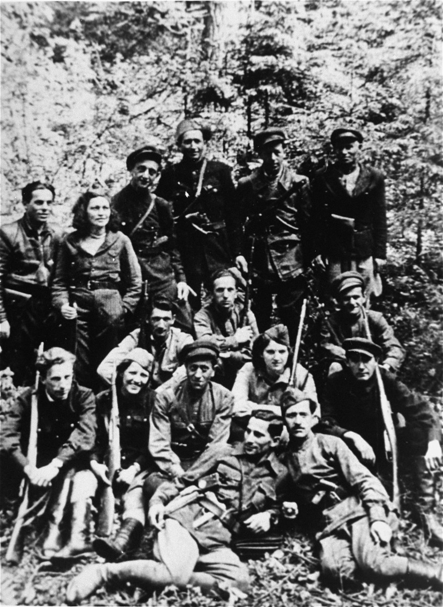 Group portrait of a Jewish partisan unit operating in the Lithuanian forests.  Many of its members had been involved in resistance activities in the Kovno ghetto.

Pictured in the bottom row (from left to right) are Szymon Block and Mosze Szejman; second row: Michael Lefkowitz; Rivka Boruchowicz Tepper; David Tepper; Rivka Block; and Shlomo Brojer; third row: Yudel Edelman; Runia Schtrom; and Aaron Tabacznik; fourth row: Yankel Ratner; Ester Schtrom; Eliezer Zilberis; Liebe Zajac; Berl Sztern, and Itzhak Yuchnikov.