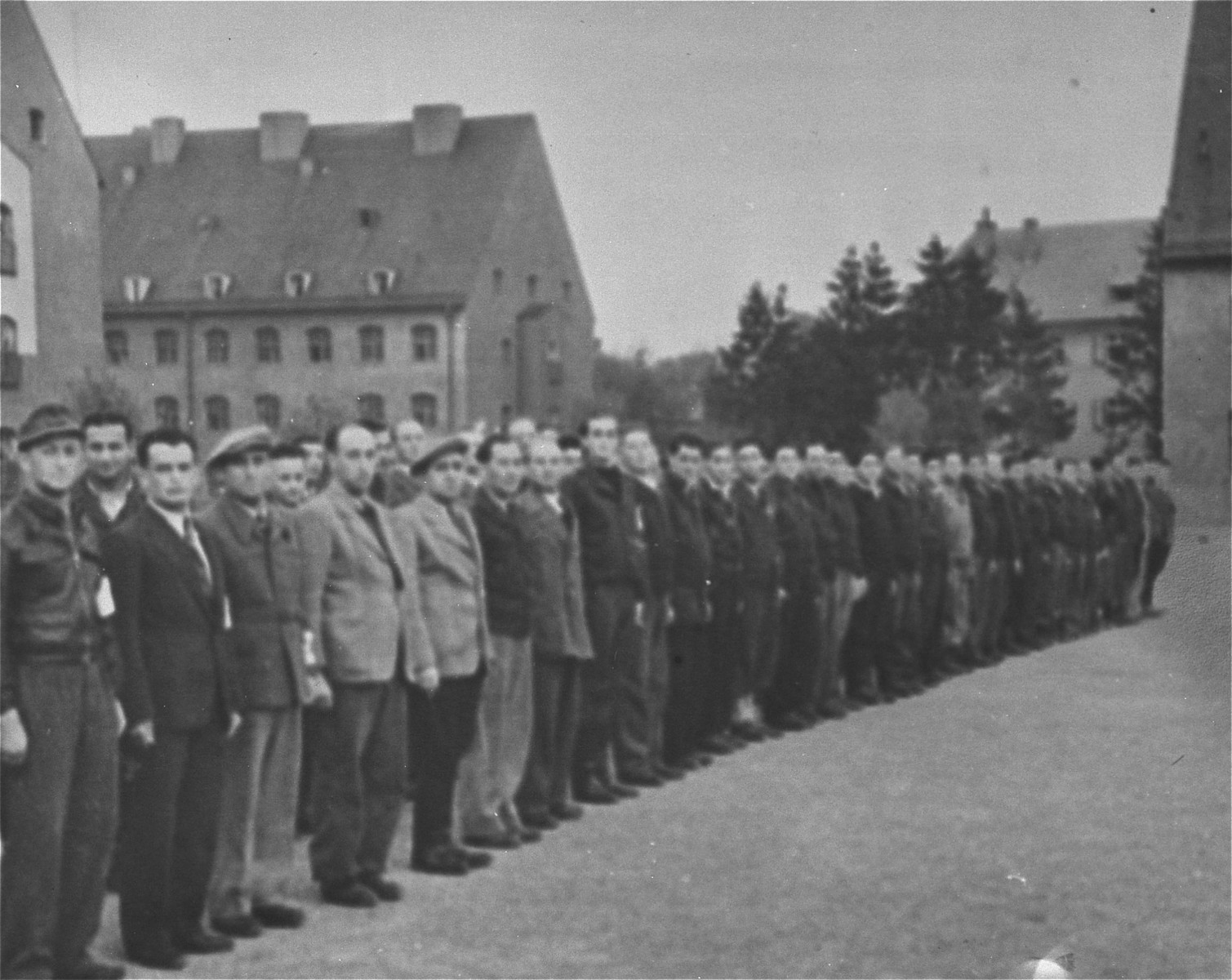 Members of the Jewish police force at the Landsberg displaced persons' camp line up in the main square of the camp. [Oversized print]