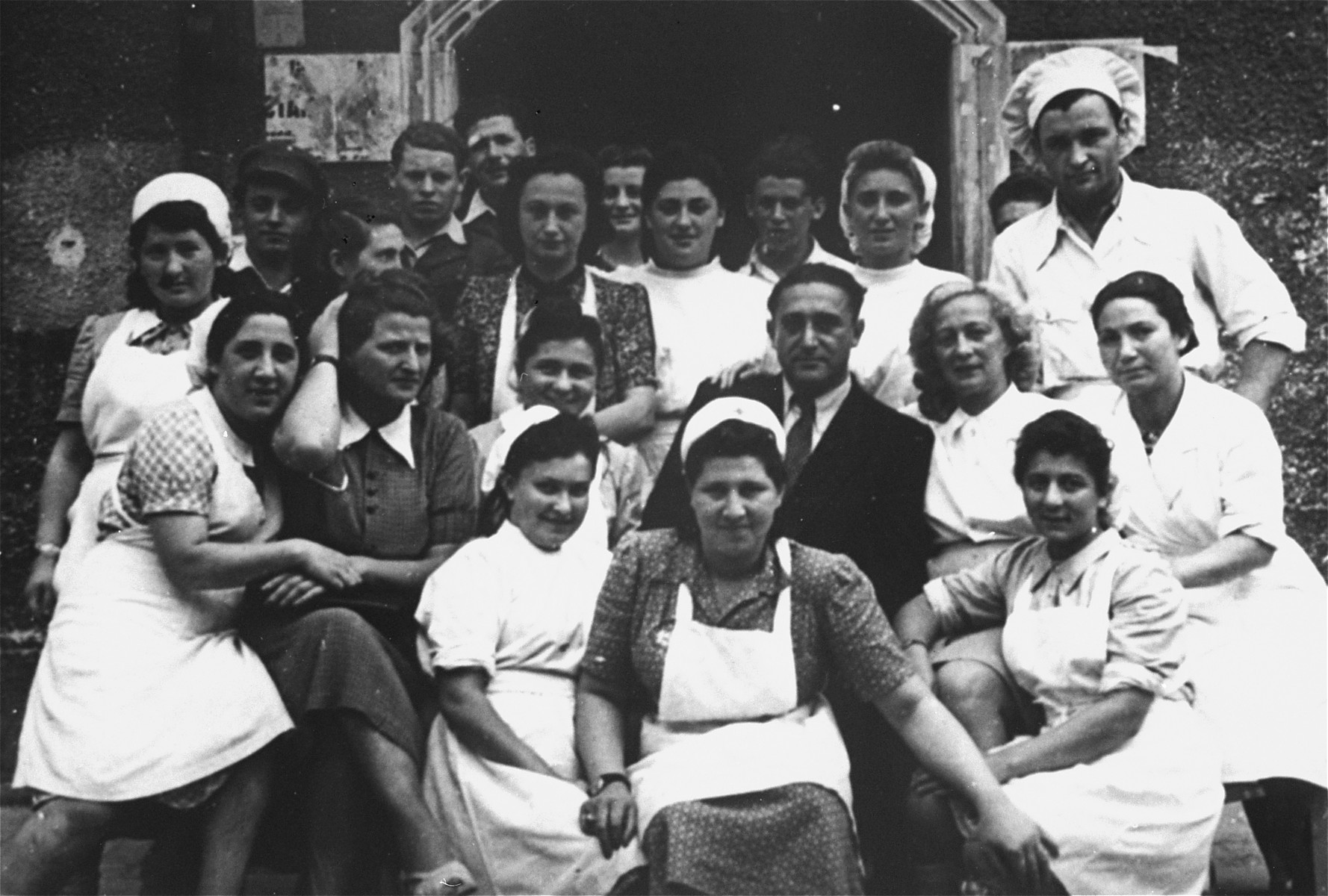 The nursing staff at the UNRRA house in the Landsberg DP camp. 

Second from right in the back row (next to the chef) is Tonia Rotkoff.