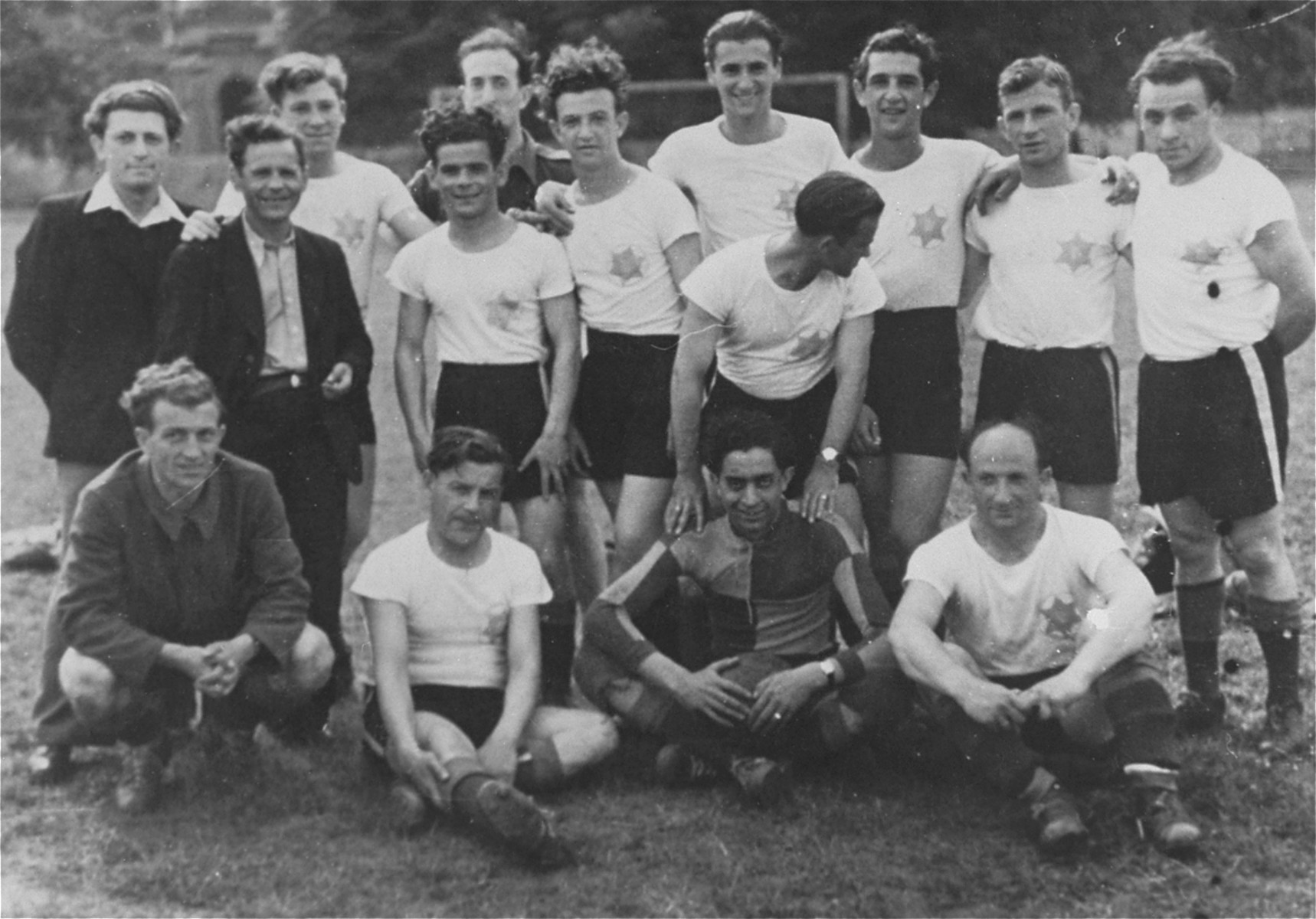 Group portrait of the Jewish soccer team in the Hanover displaced persons' camp.

Among those pictured are Ignaz (Yidel) Rotmench (first row, second from the left), Daniel (Szwajcer) Schweitzer  (standing third from the right), and his brother, Leo Schweitzer (standing fifth from the right).