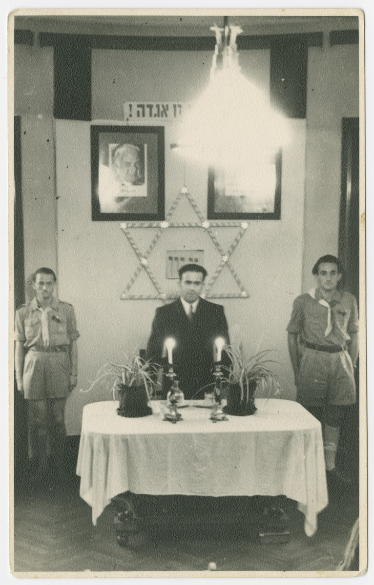 Jewish displaced persons conduct a memorial service to Theodore Herzl and Chaim Nachman Bialik in a convalescent home in Rome.

The original caption reads: "To Zelig Appel: As a memory from Henryk Turk.  This picture is taken during a tribute to Dr. T. Herzl and Chaim Nachman Bialik in an AJDC convalescent home in Rome."