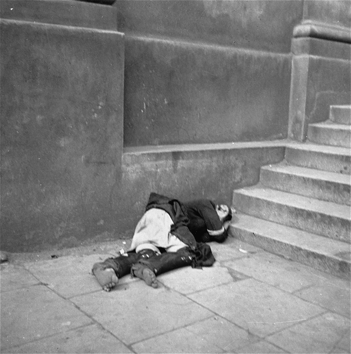 The Body Of A Dead Woman On The Street In The Warsaw Ghetto