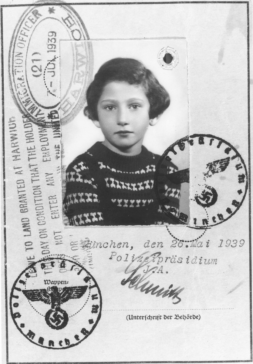 Children's identification card issued by the German police to Inge Engelhard, in which she has been given the middle name of "Sara" and declared stateless.

This card was used in lieu of a passport when Inge entered England on a Kindertransport and was stamped by immigration authorities in Harwich.