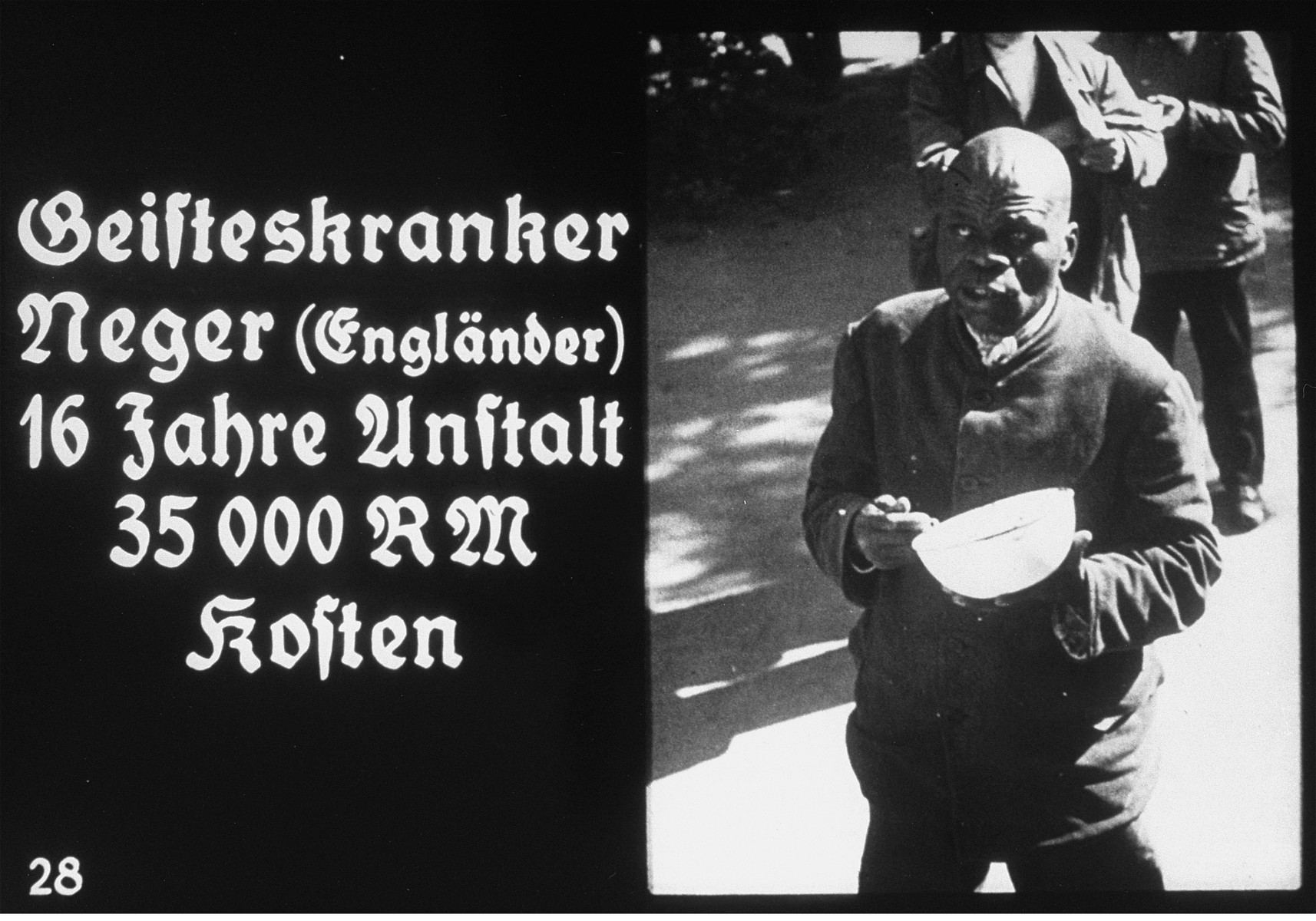 Propaganda slide featuring a mentally ill British Black man in an unidentified asylum.  

The caption reads: "Mentally ill Negro (British)/16 years of care/costs 35,000 RM.