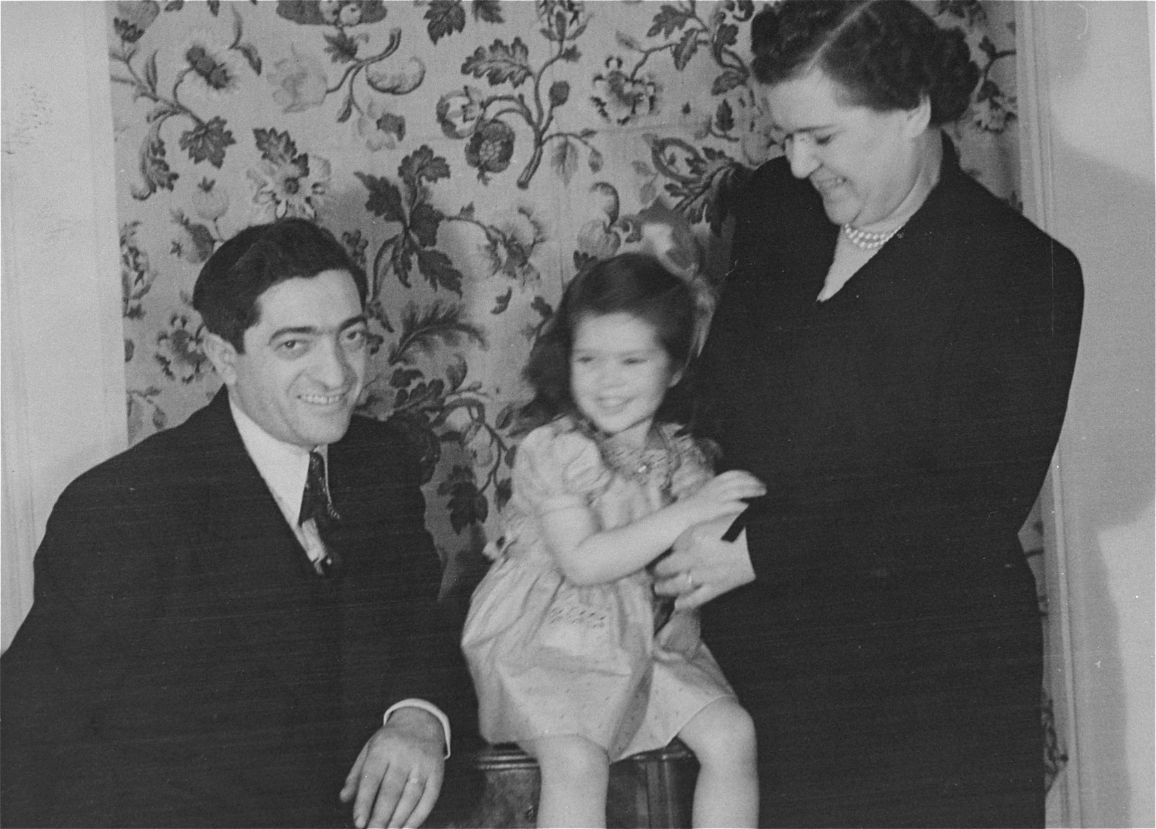 Portrait of the donor, Haviva, with her parents, Eliezer and Chaya Gar Kaplan, in their home in New York.