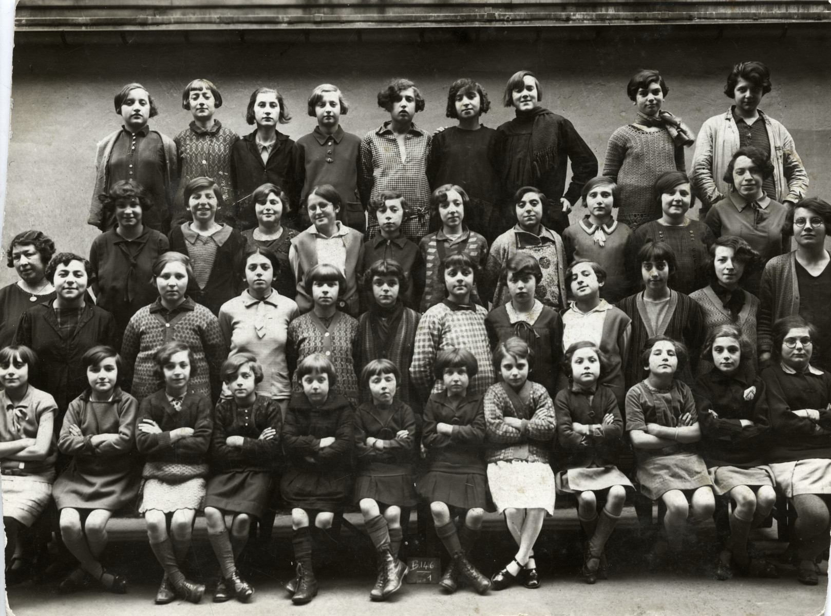 Group portrait of the girls in the Ecole Israelites, Hospitaliers St. Gervais, a school for Jewish refugees in Paris.

Miriam Einhorn is pictured in the top row, fifth from the left.