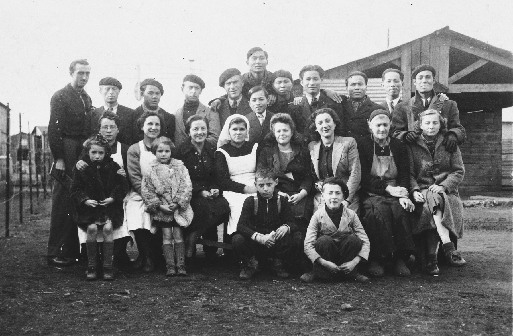 Portrait of Jewish internees in a camp in Haute Garonne.

Among those pictured is Janka Penner (seated second from the left).