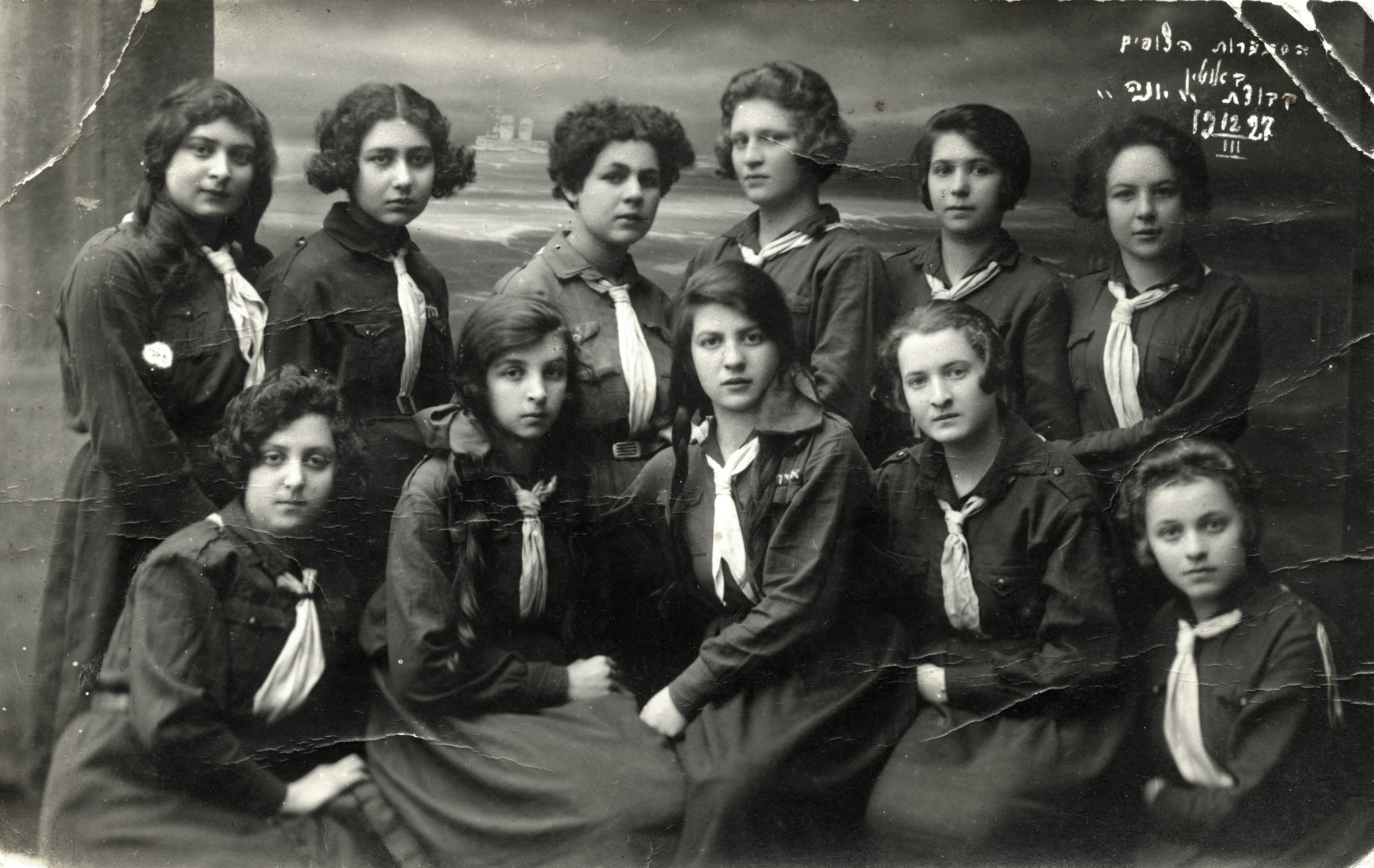 Group portrait of teenage girls in a Jewish scout unit in Utena.

Chana Rudashevsky is pictured in the top row, second from the right.