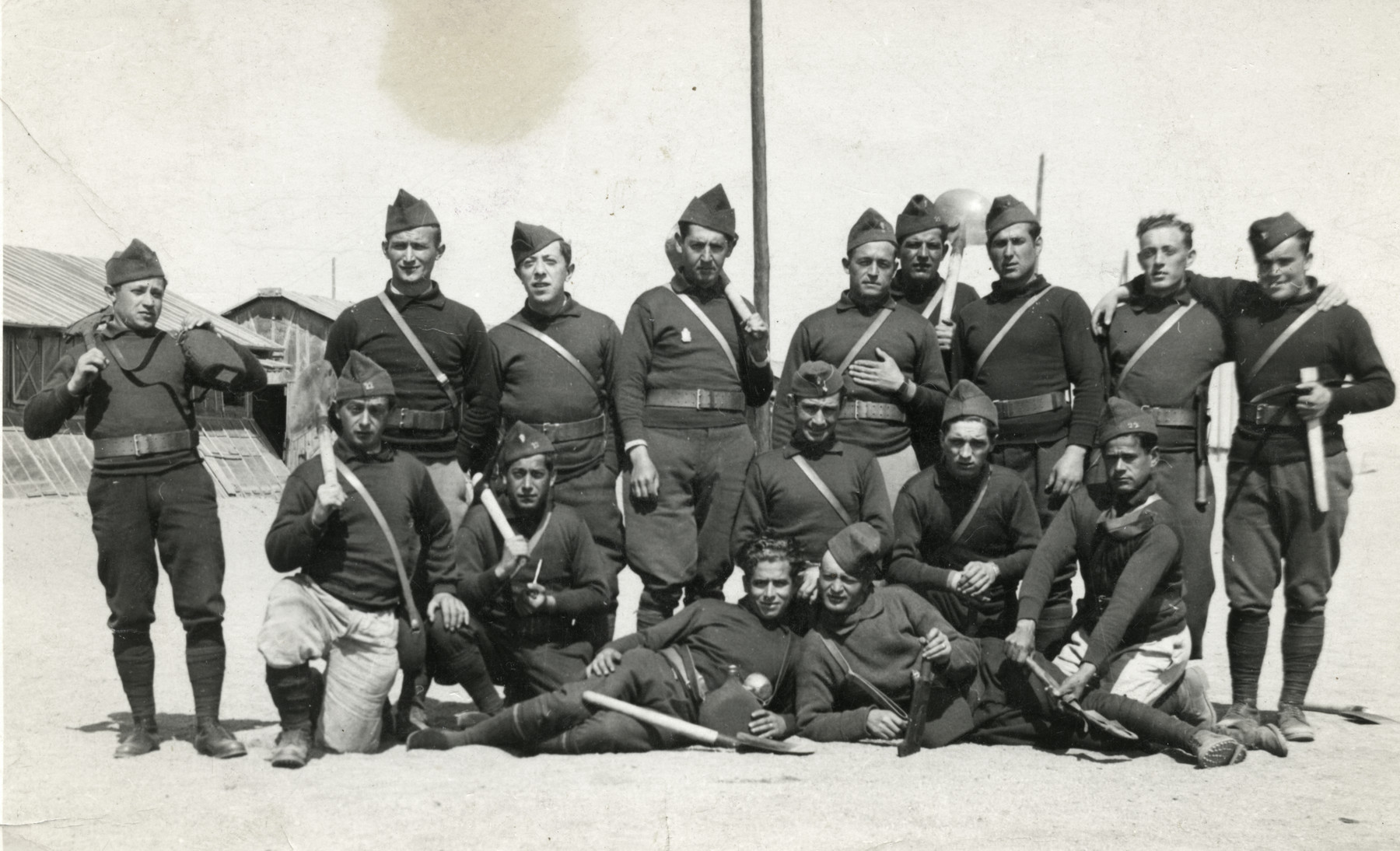 Group portrait of members of the Engage Volontaires, foreign-born Jews in a French paramilitary unit, carrying shovels.

Mendel Max Rosensweig is pictured on the bottom left.